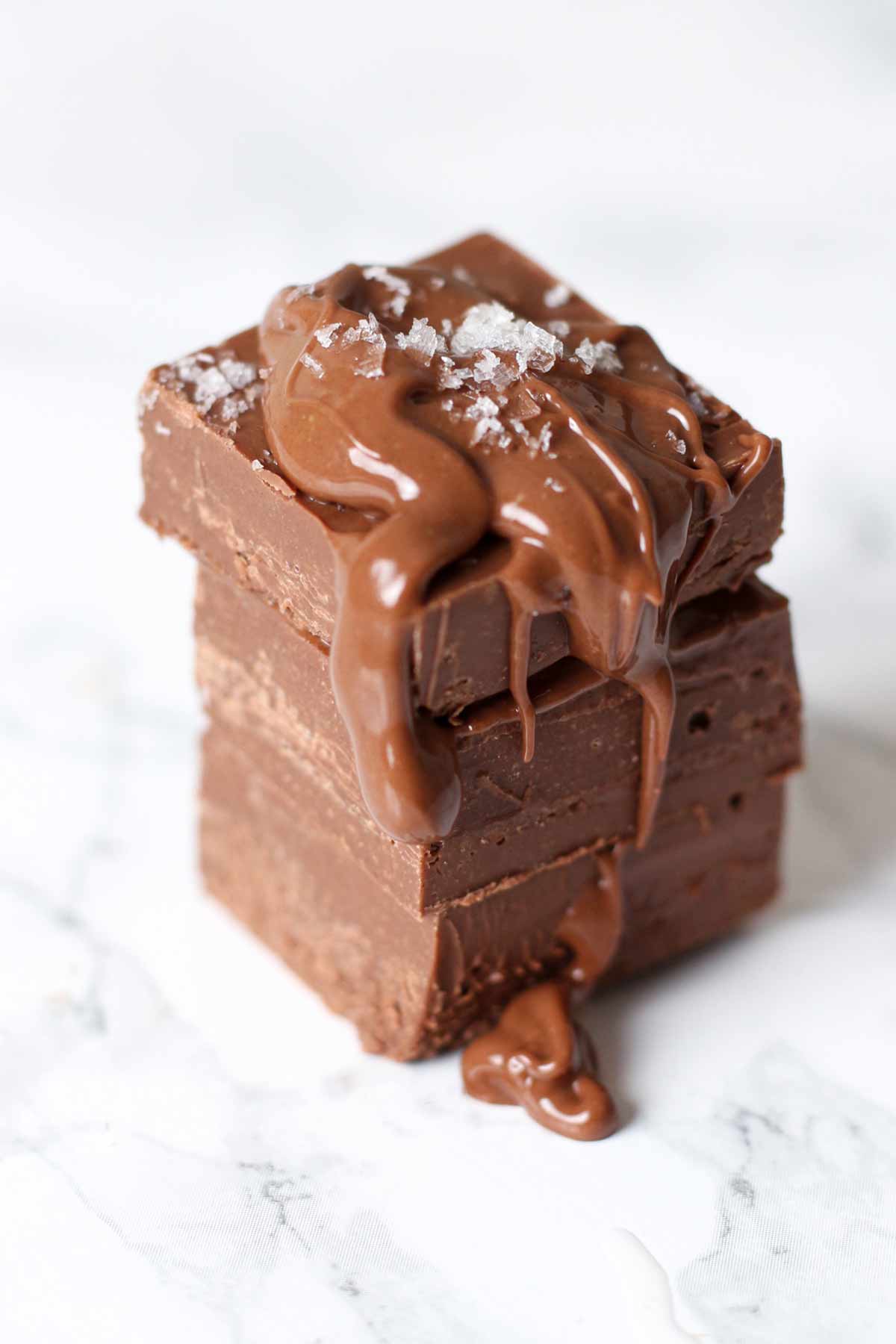 3 ingredient sea salt nutella fudge in a stack of 3 small pieces