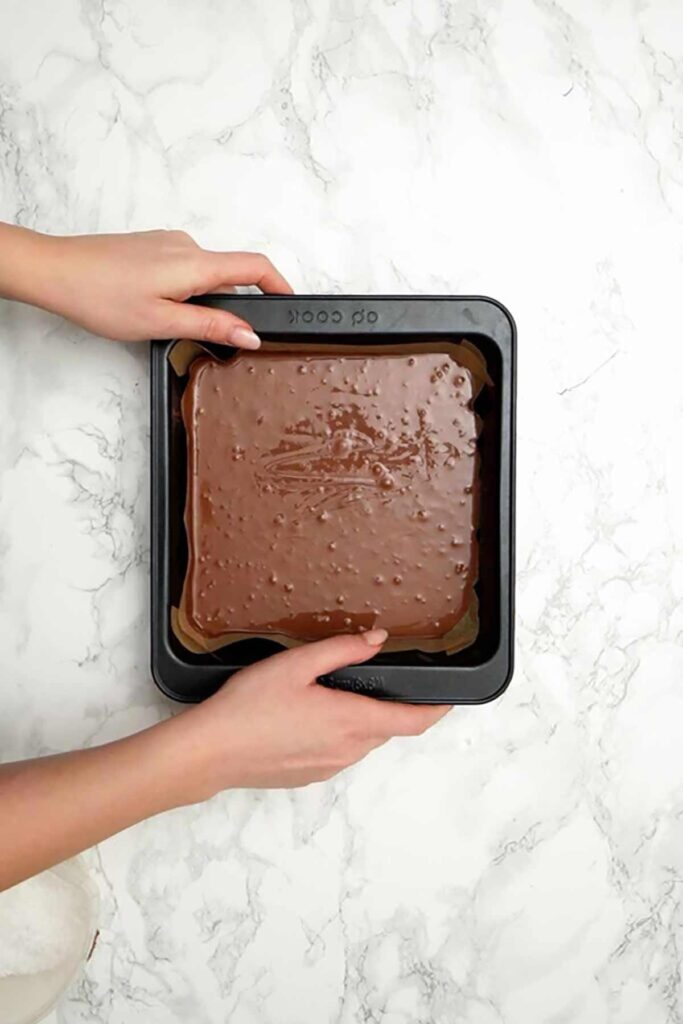 melted mixture in lined baking tin