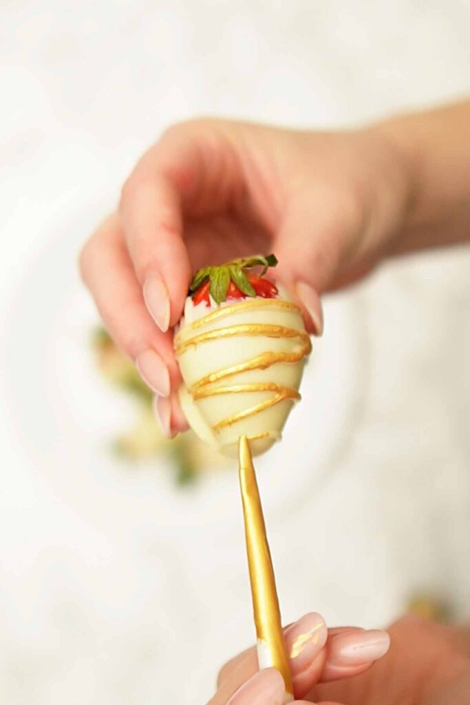 painting a strawberry with metallic paint