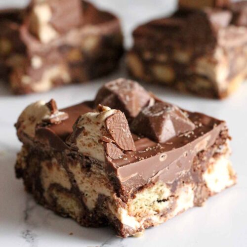 a square of traybake with milky way bar pieces and magic stars on top