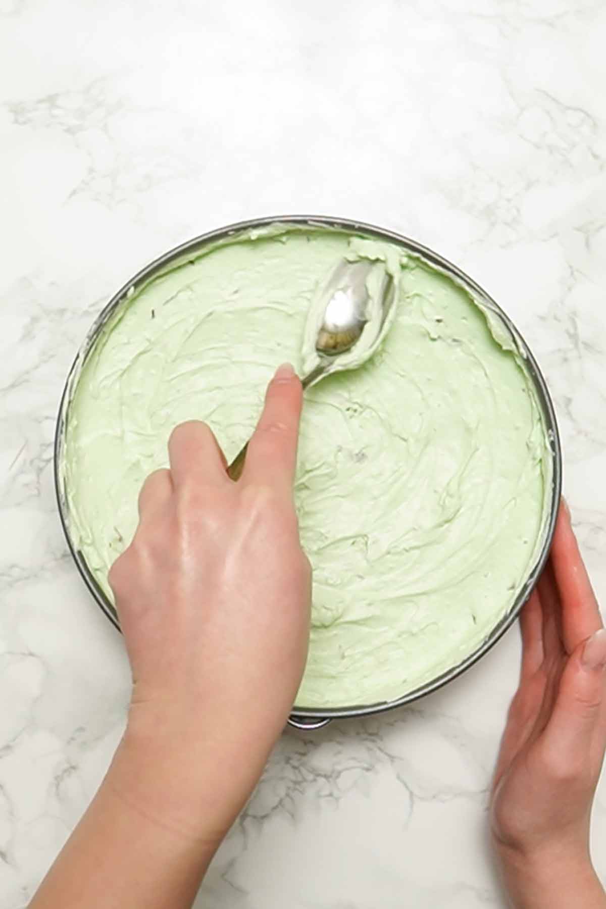 spreading mint filling into tin