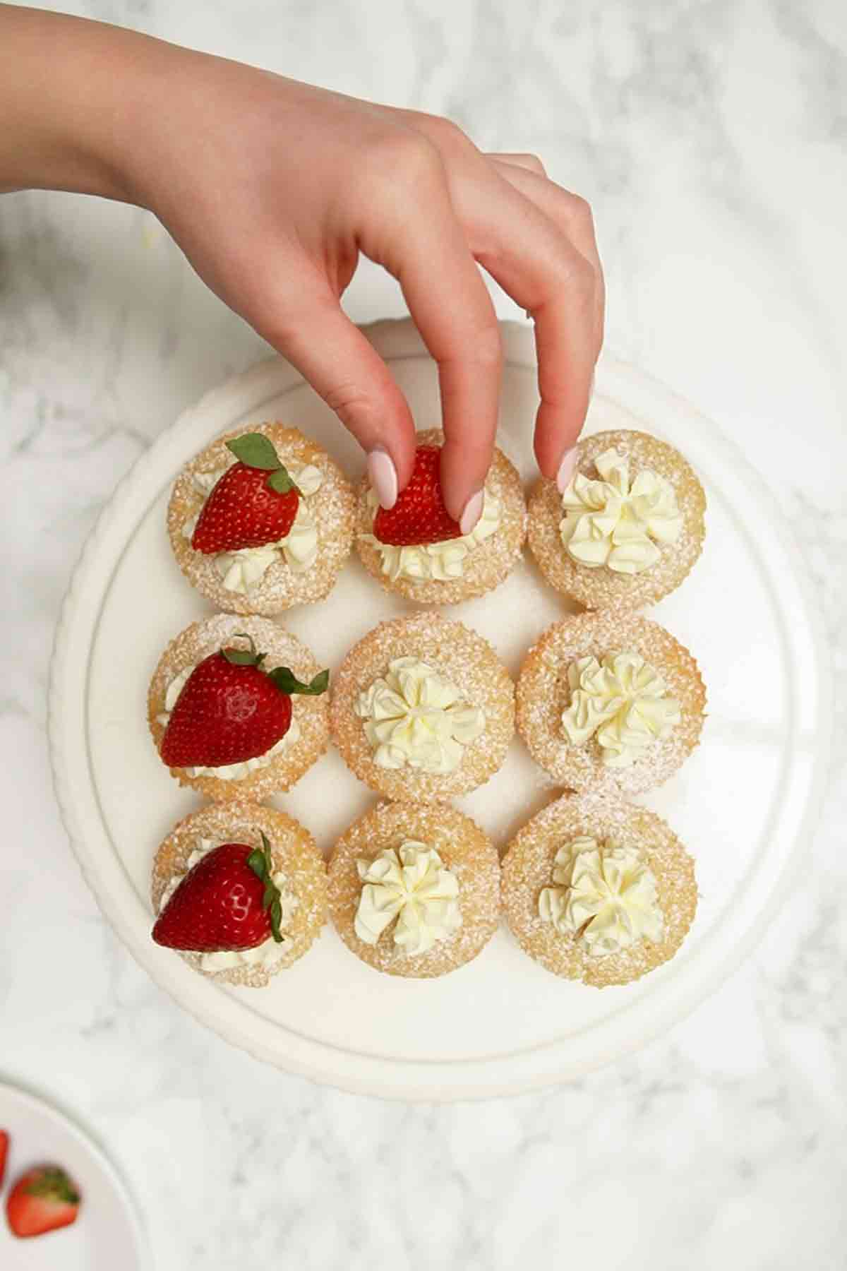placing strawberries on top