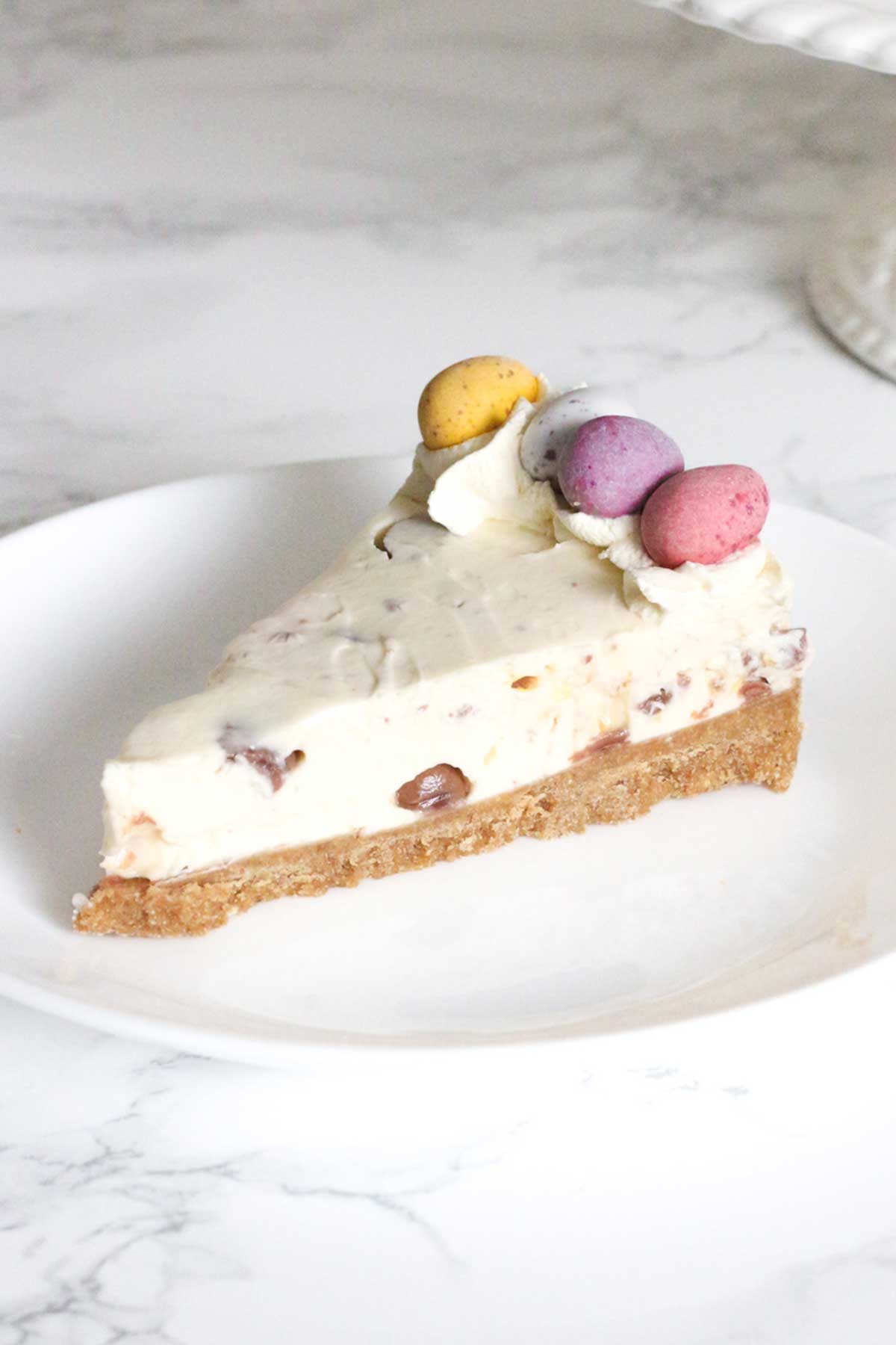 slice of mini egg cheesecake on a plate