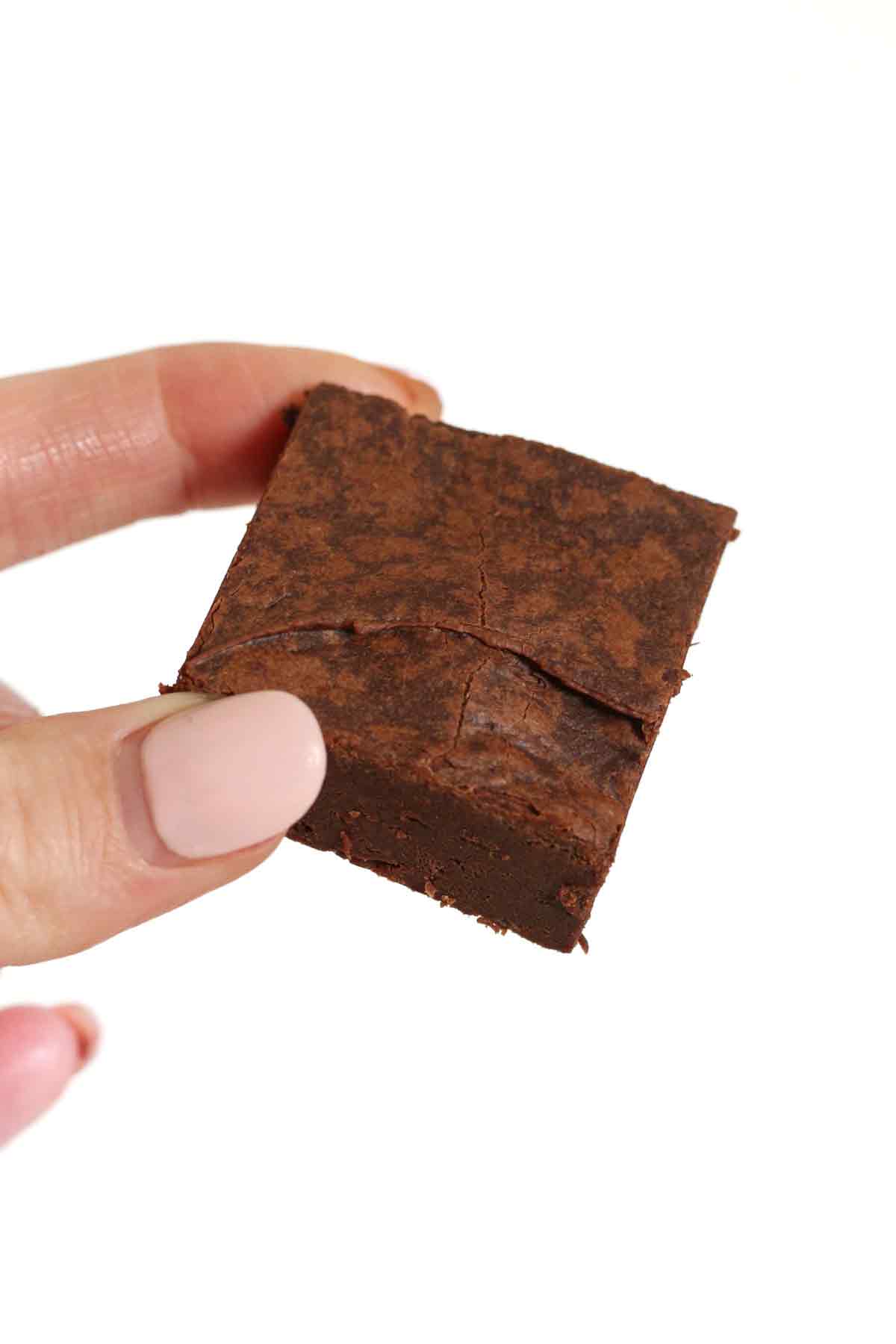 hand holding up 3 ingredient condensed milk brownies