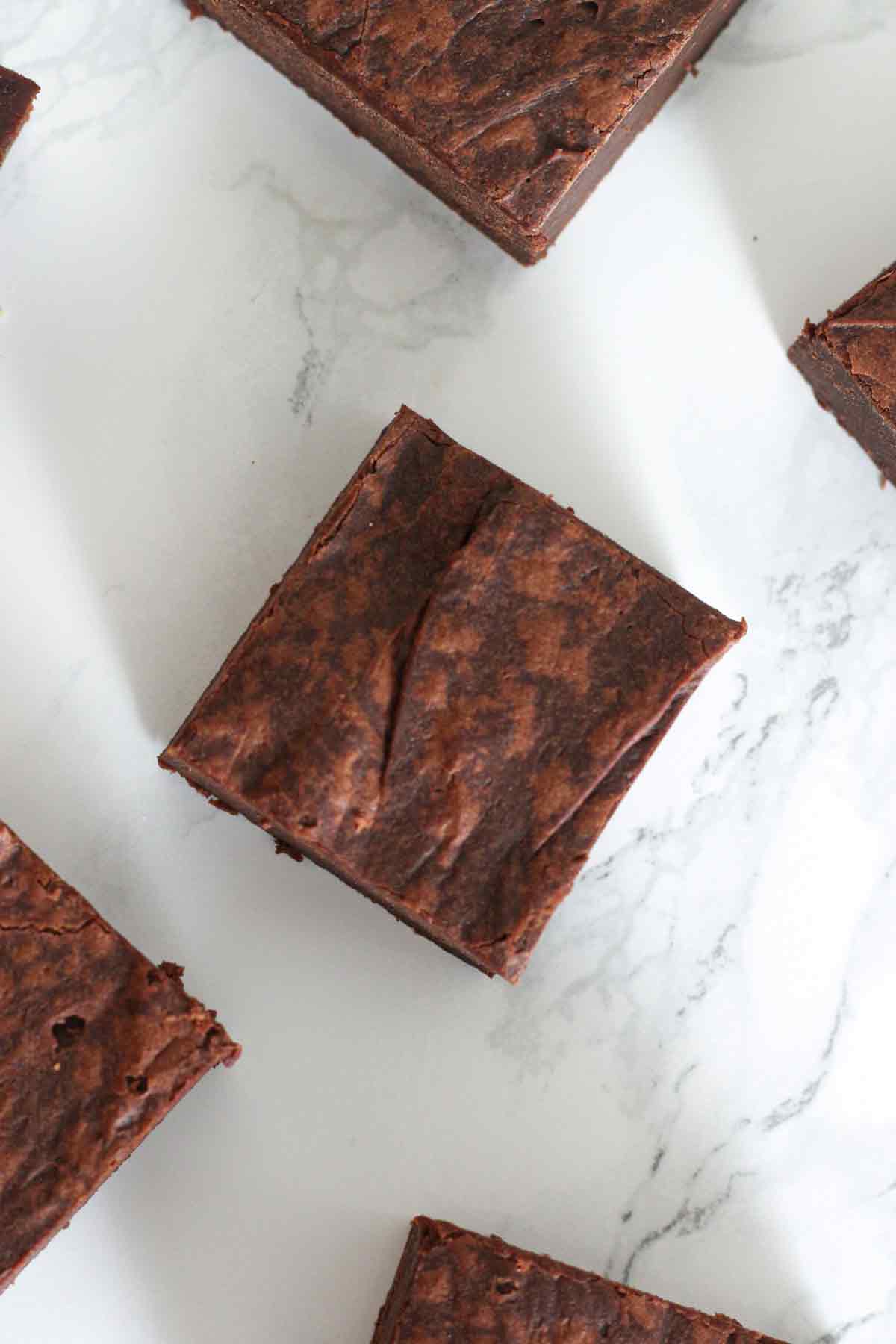 overhead shot of brownies on a white surface
