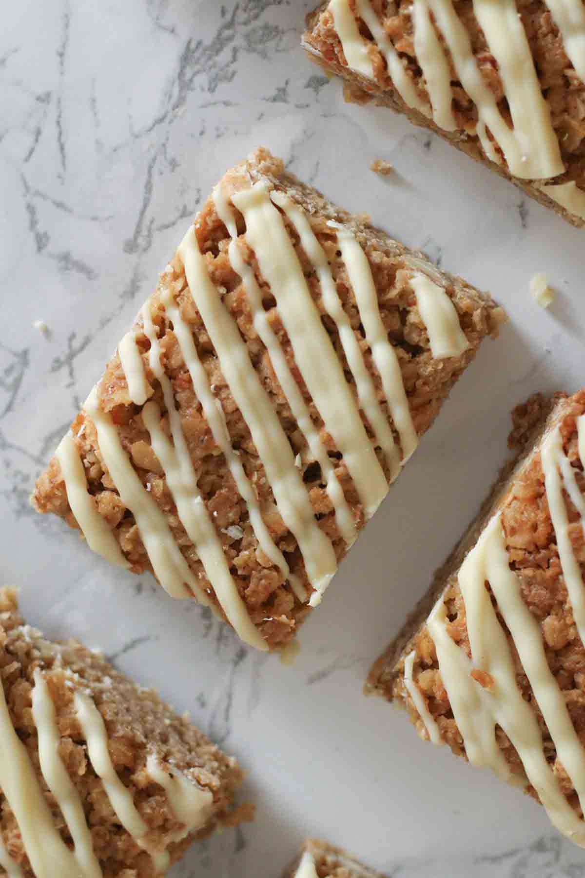 overhead image of white chocolate flapjacks with drizzle on top