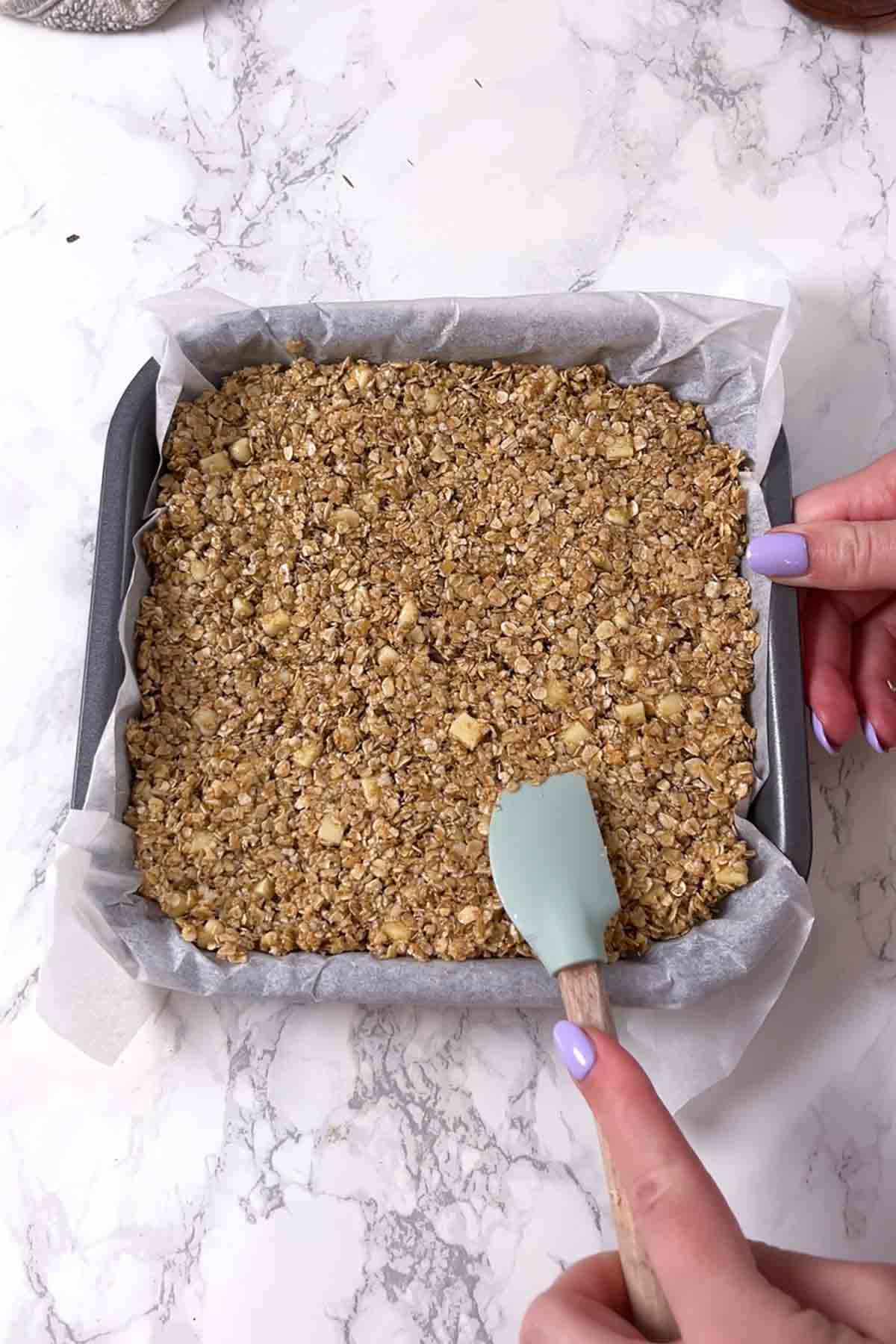 pressing mixture into lined tin