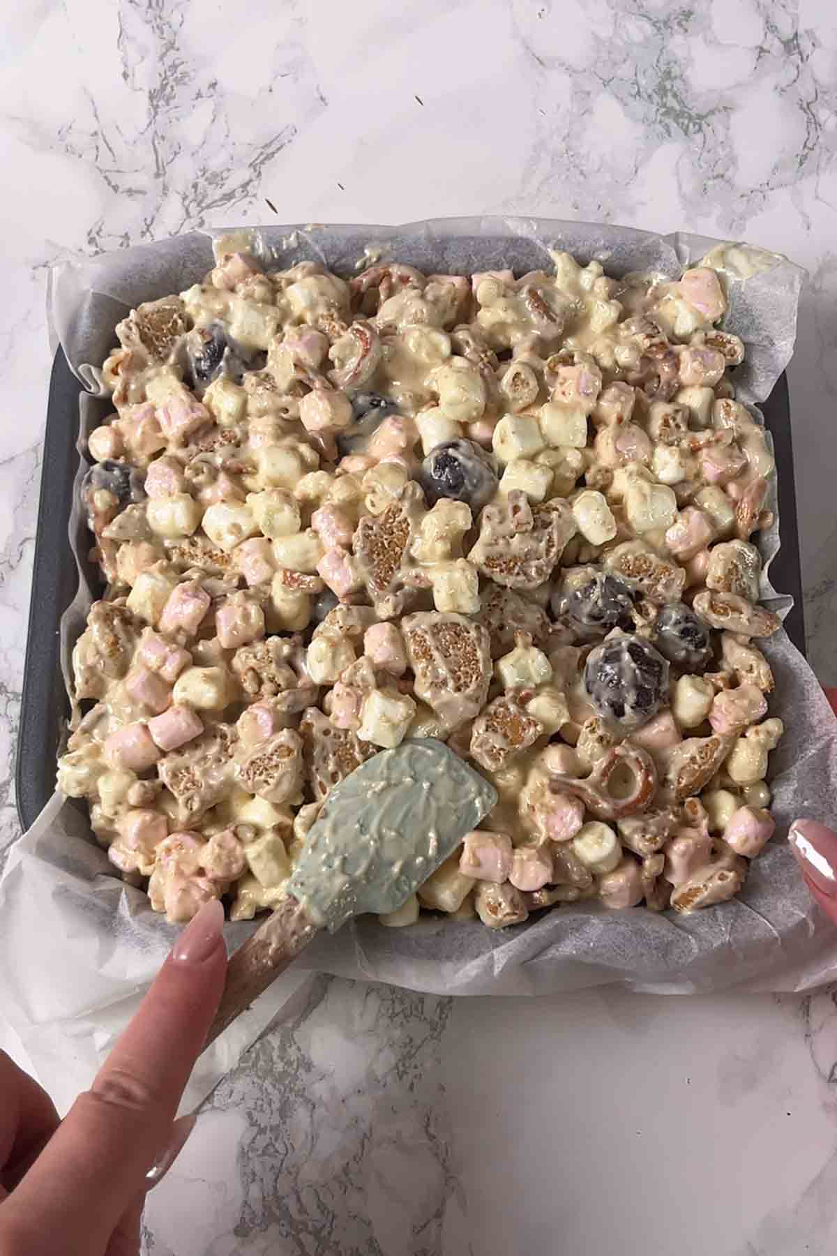 pressing mixture into tin