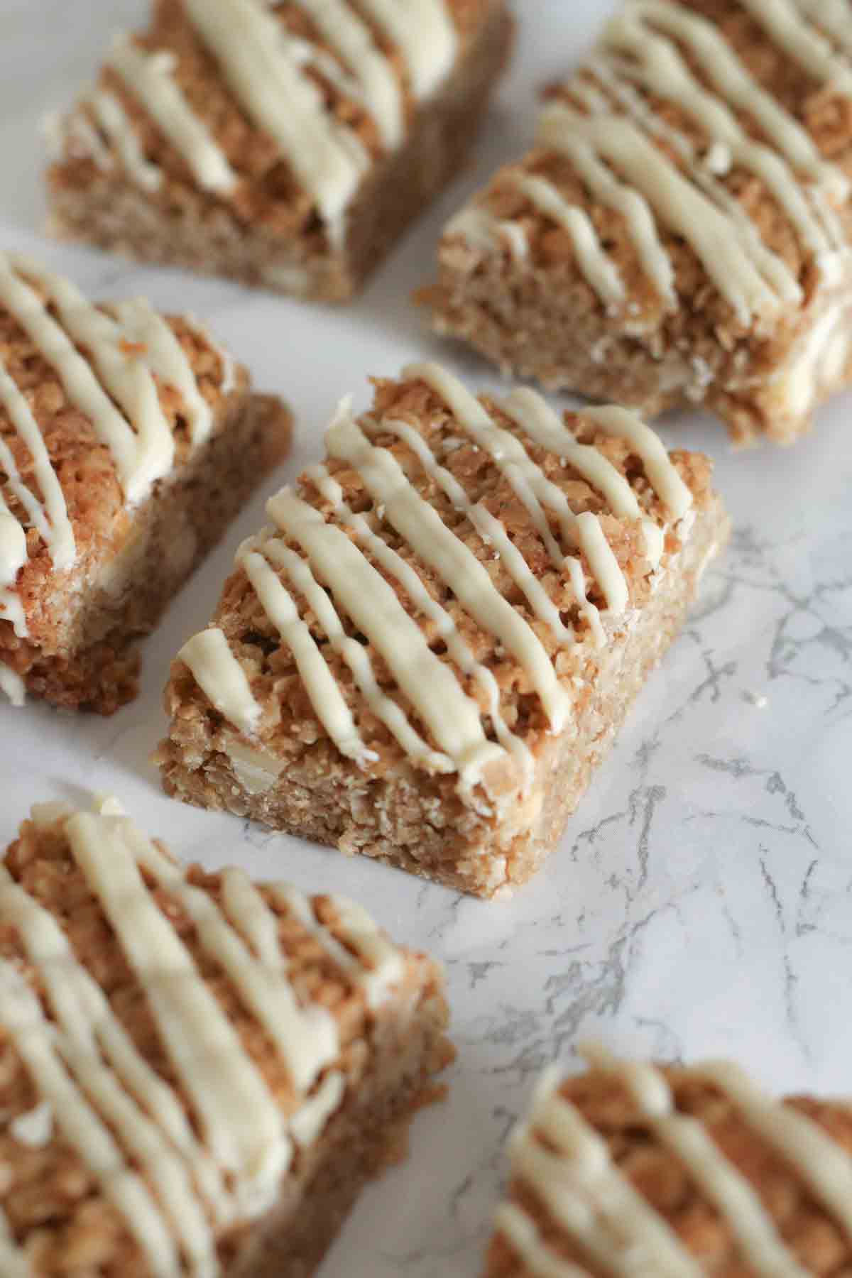 white chocolate flapjack slices on a white surface
