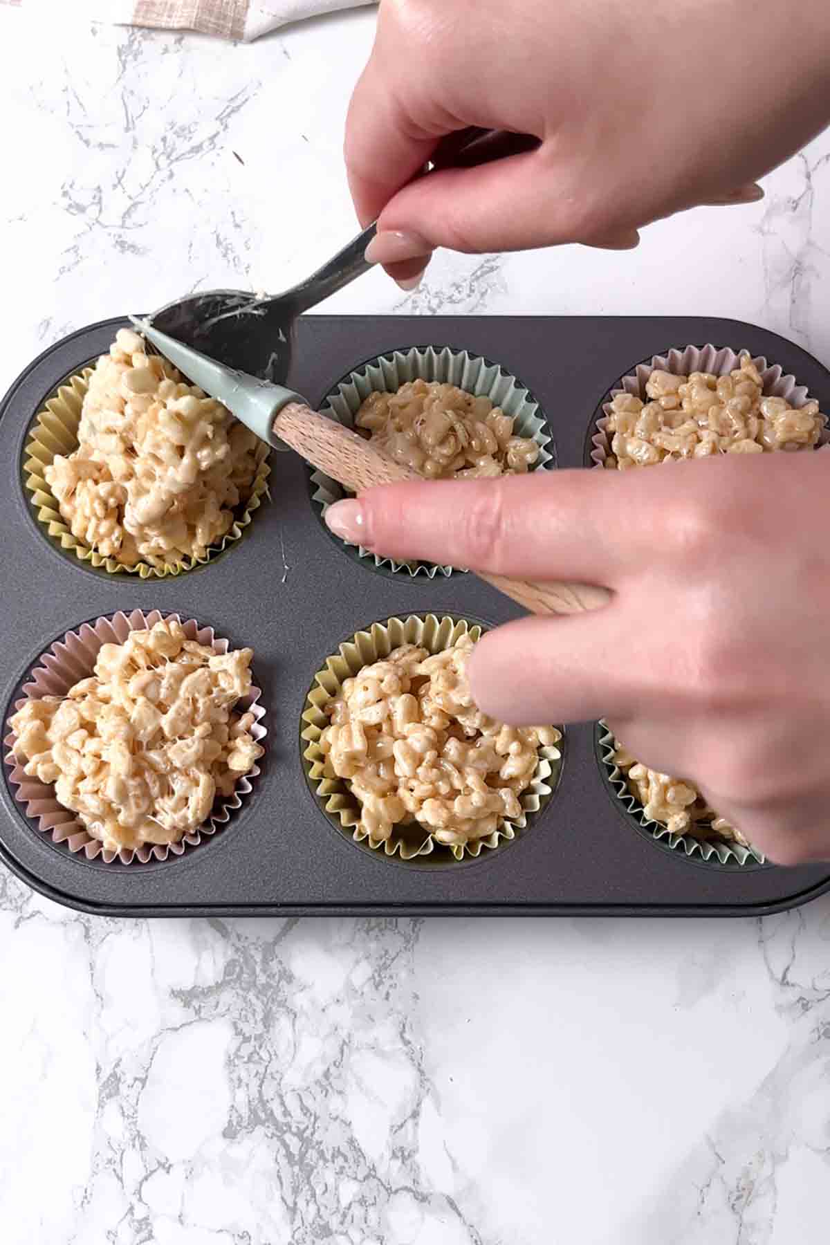 putting the mixture into cupcake cases