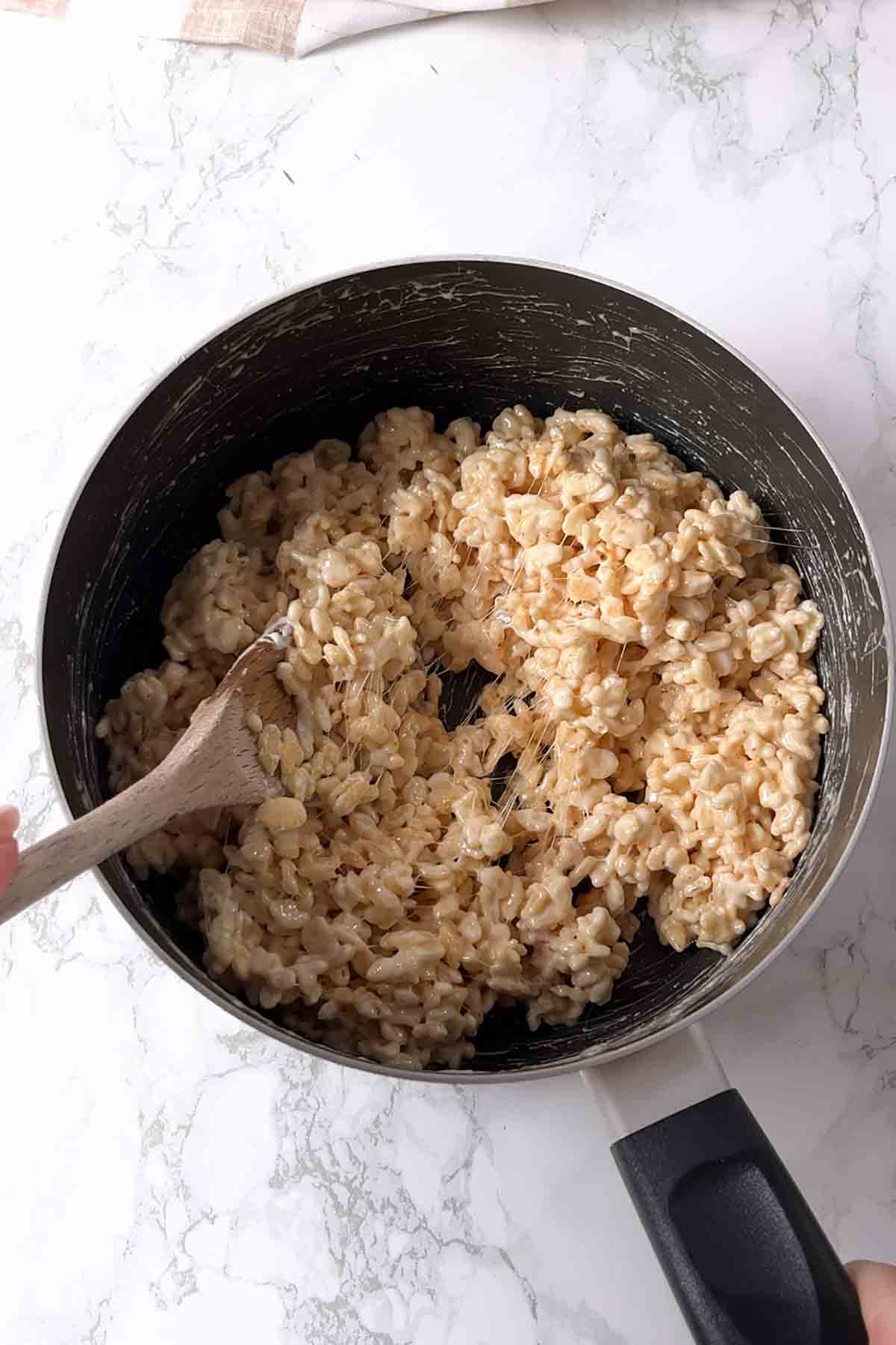 sticky rice krispie mixture in saucepan
