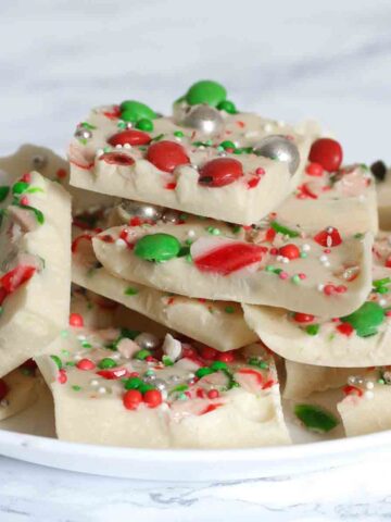 thumbnail image of peppermint white chocolate christmas bark shards on a plate