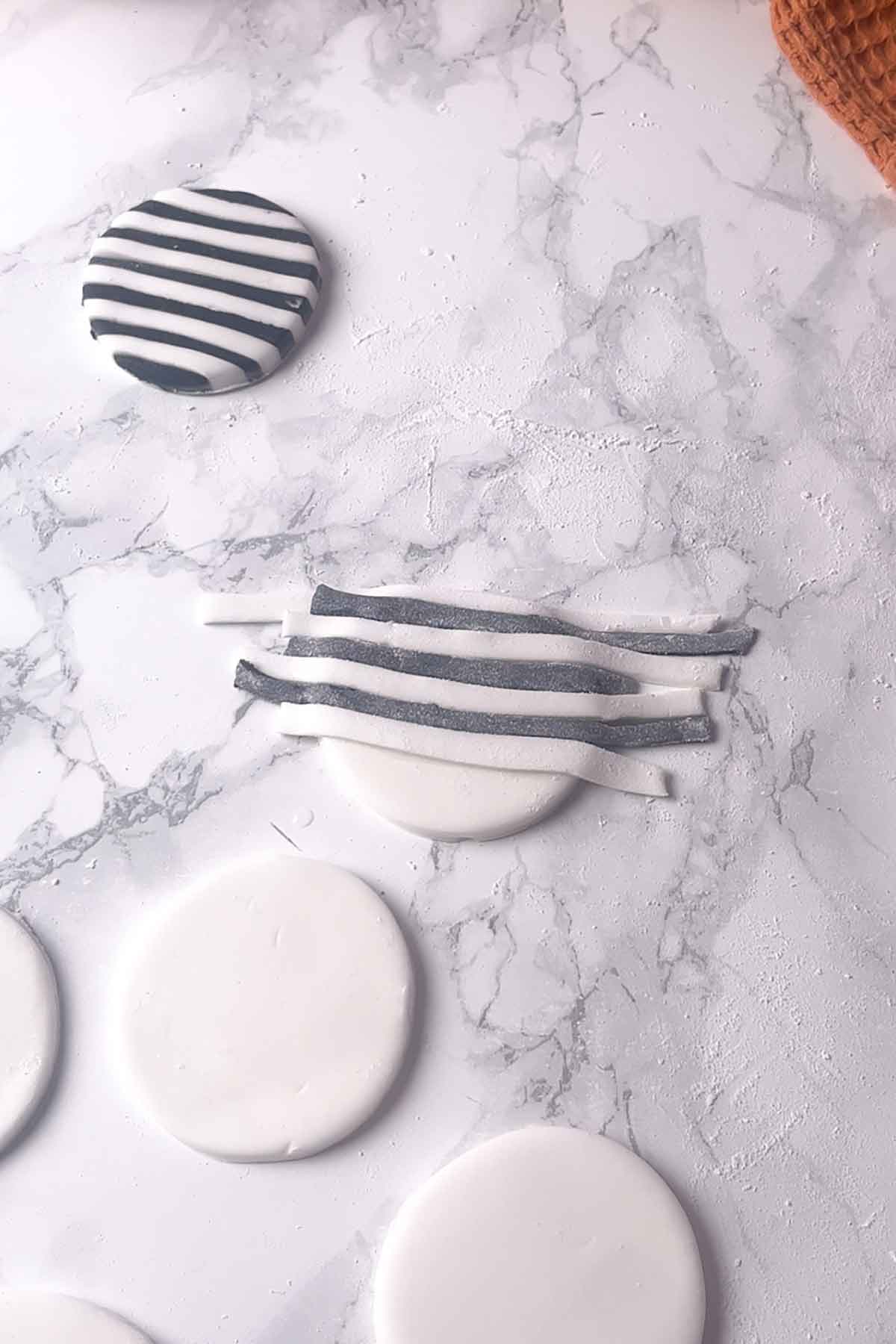 fondant strips laid over cupcake topper