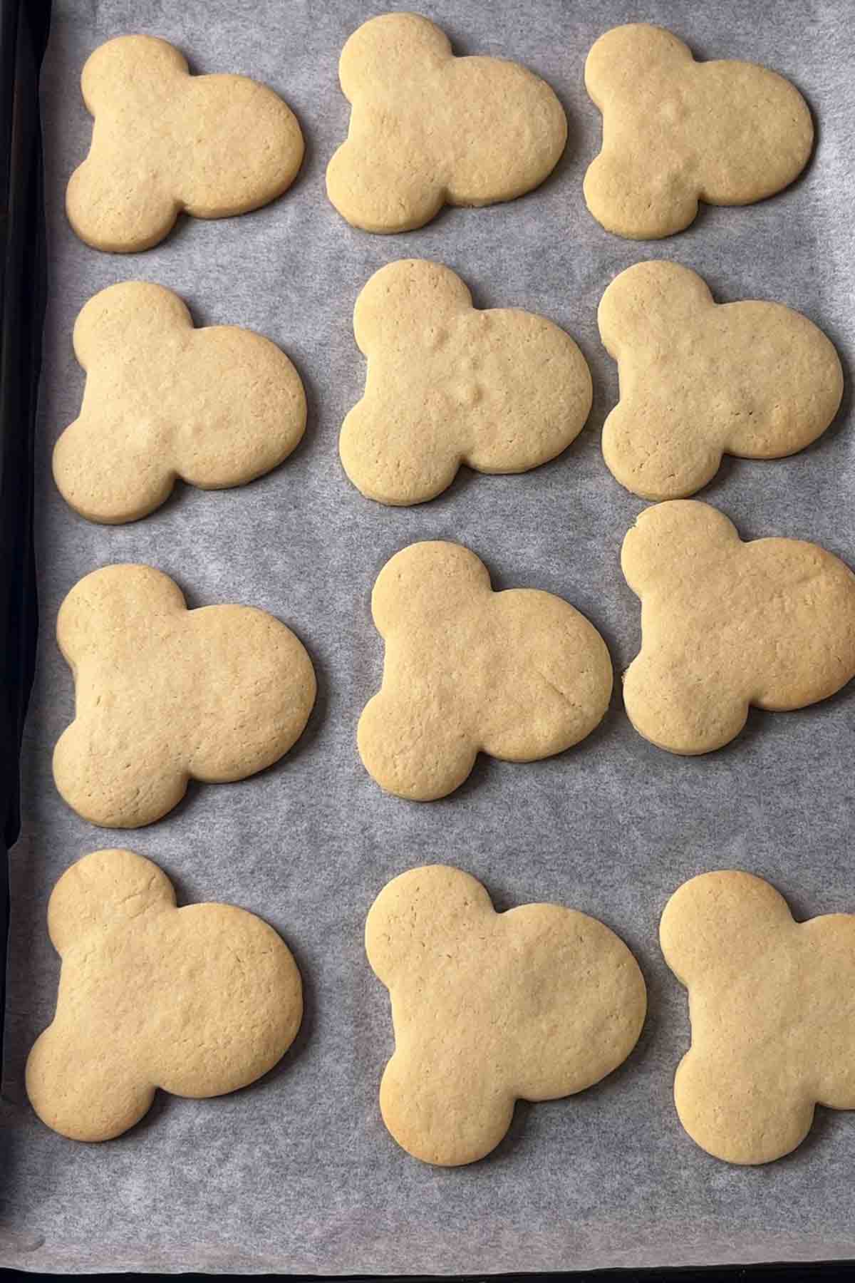 baked mickey mouse cookies on tray