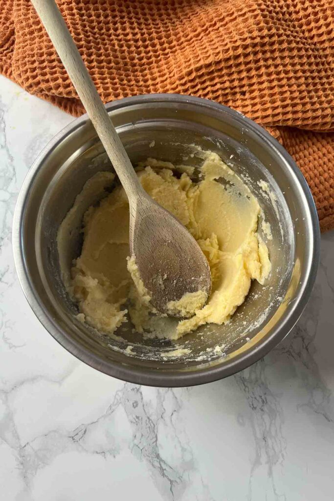 butter and sugar mixed together in a bowl