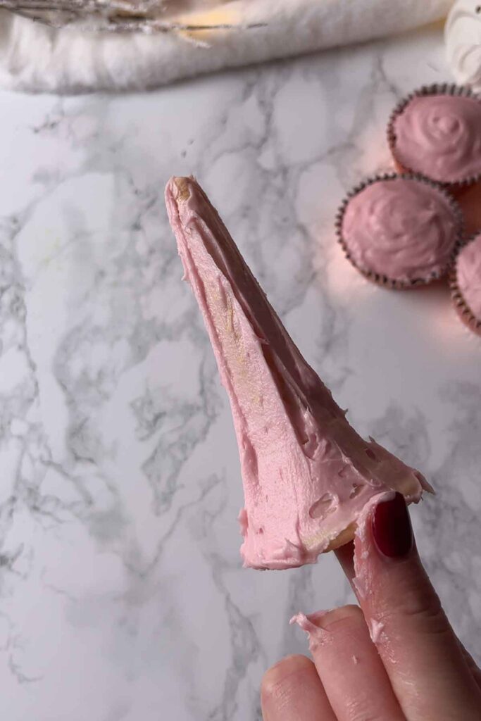 ice cream cone cupcakes covered in pink icing