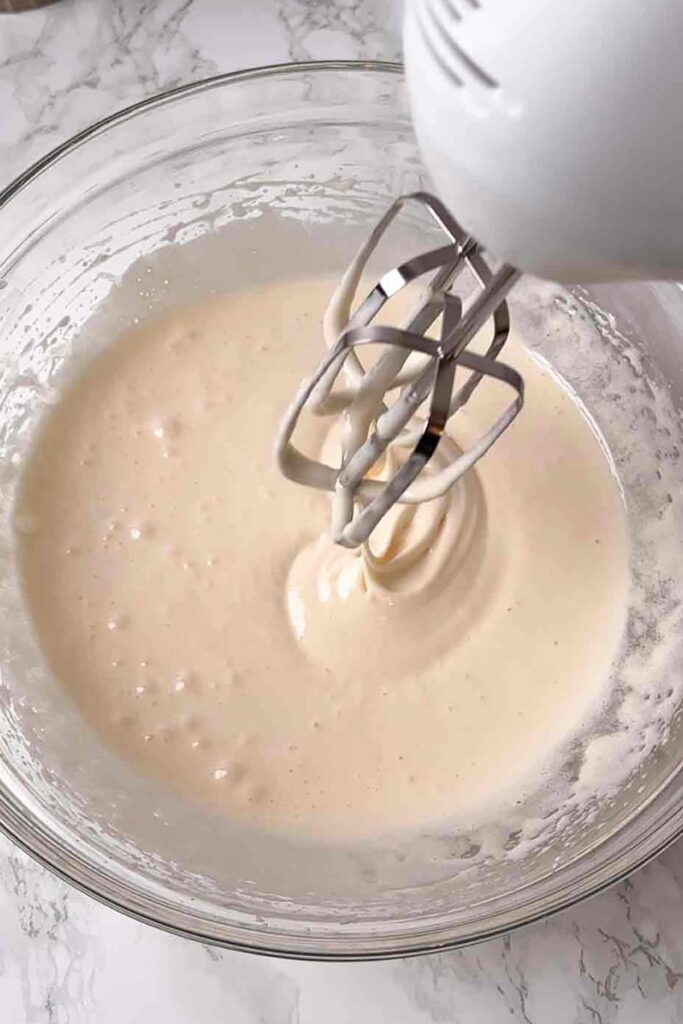 whisking eggs and sugar together