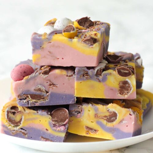 stack of pink yellow and purple cadbury mini egg fudge