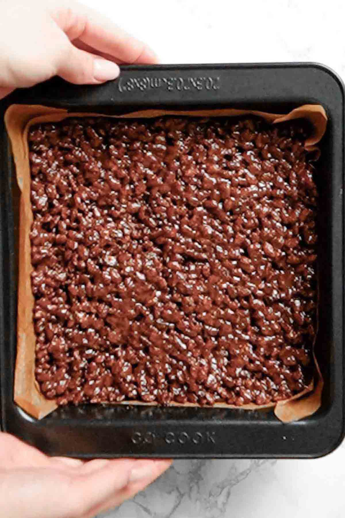 caramel cereal mixture pressed into a lined tin
