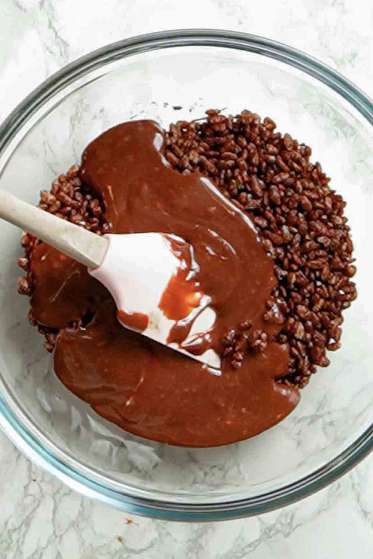 coco pops and melted chocolate in a bowl