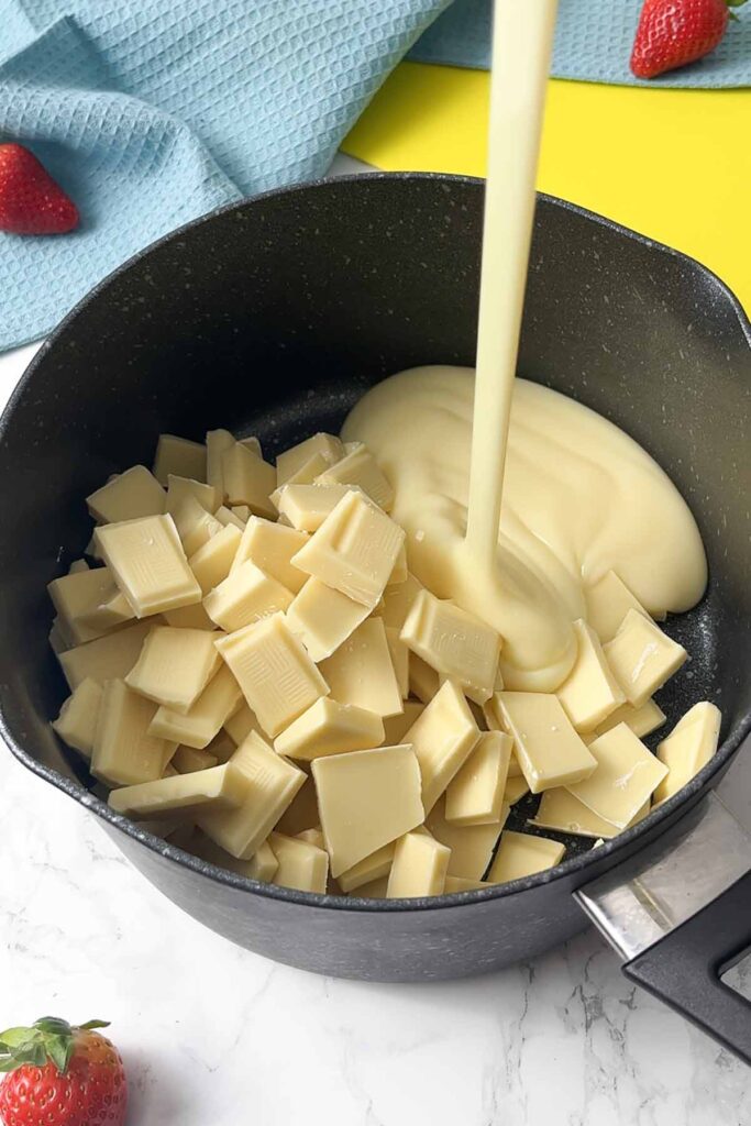 condensed milk and white chocolate in a saucepan