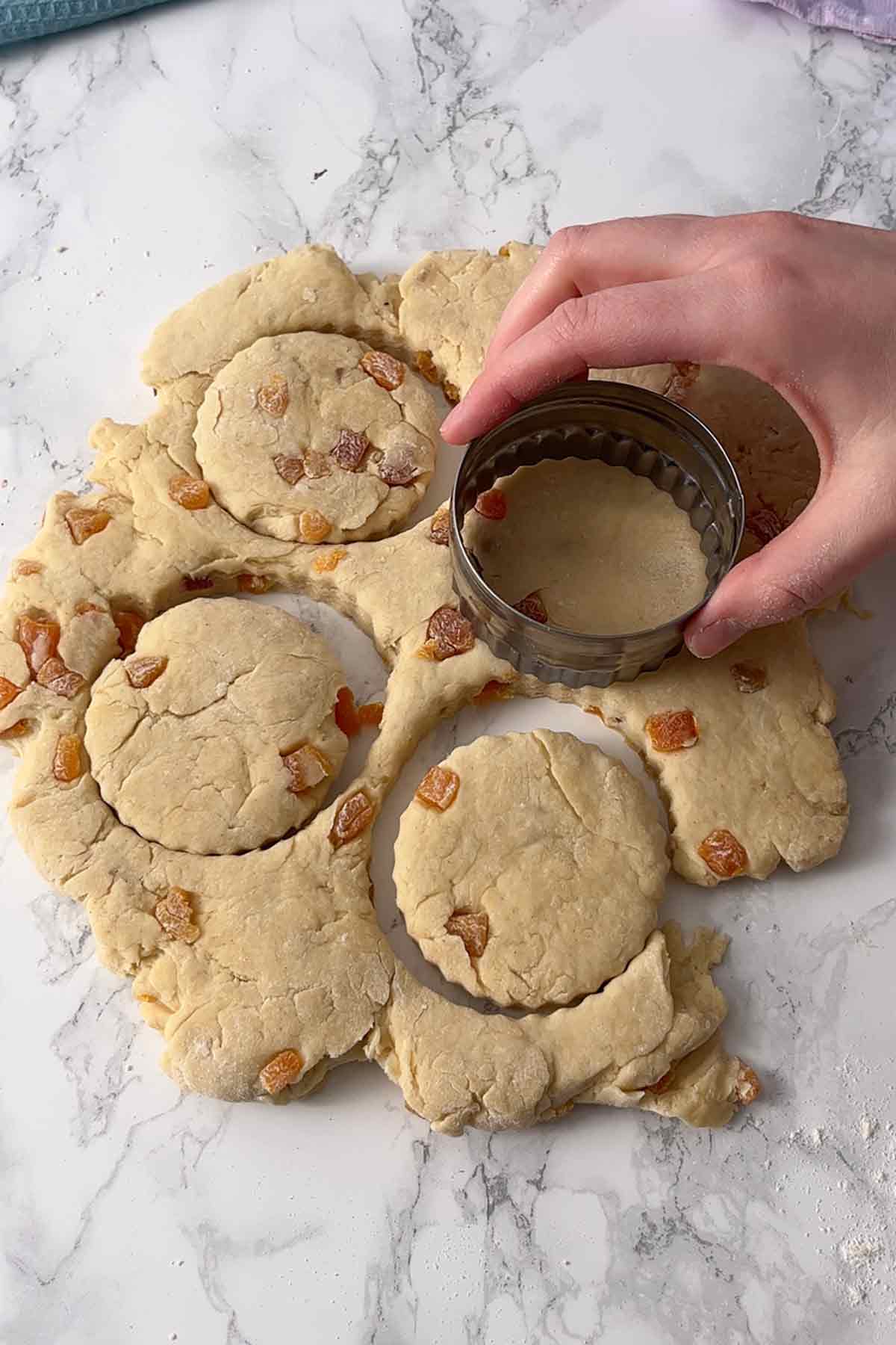 cutting circles out of the dough
