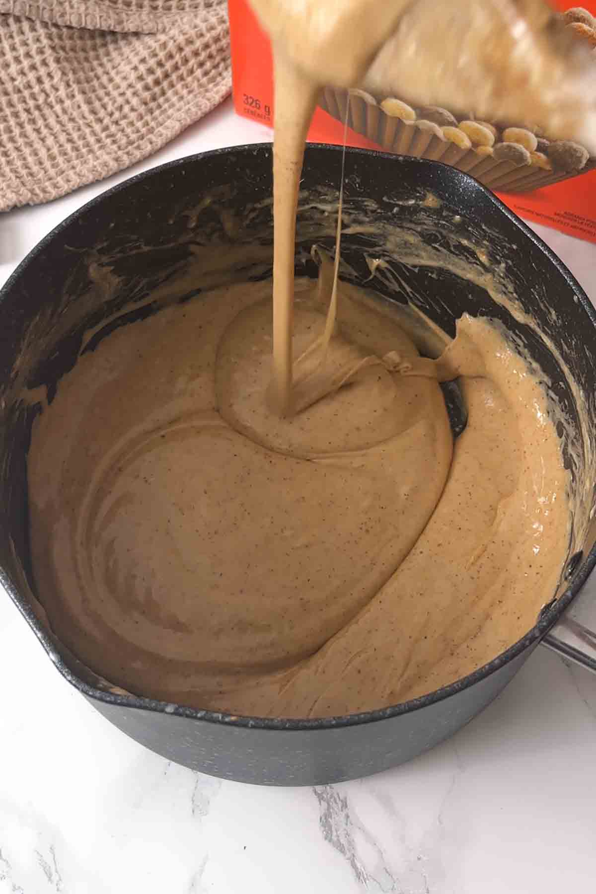 marshmallows peanut butter and butter melted together in a pot