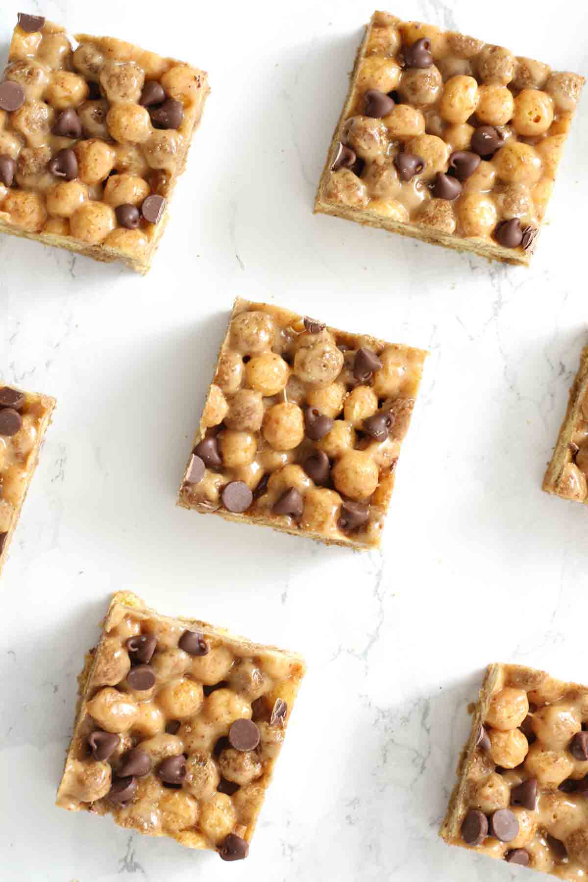 slices of reeses puffs marshmallow treats on a white surface