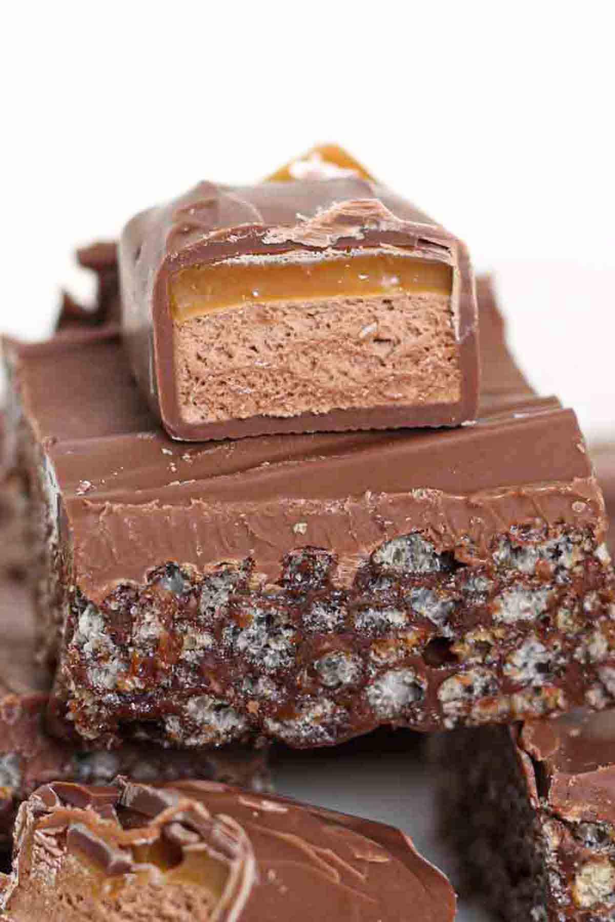 stack of mars bar tray bake squares on a plate