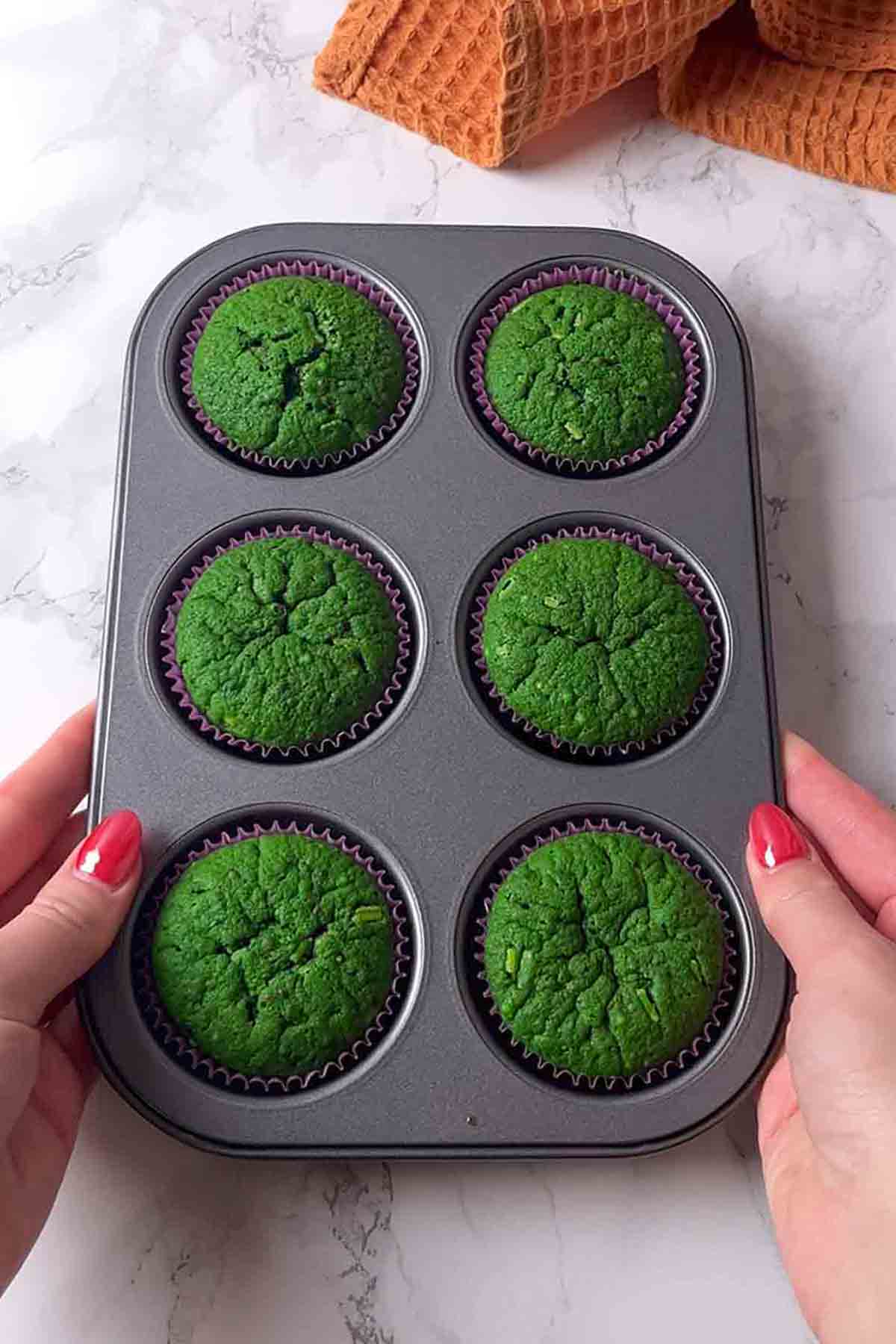 baked cupcakes in tin with funfetti sprinkles showing through