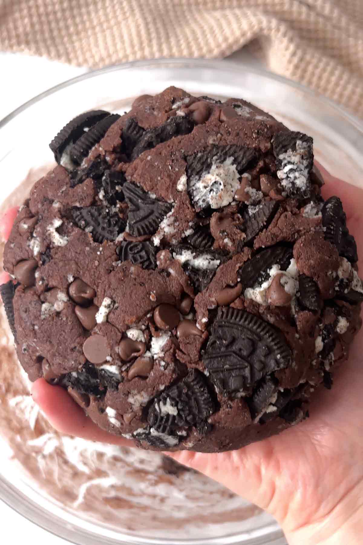 ball of cookie dough with chocolate chips and oreos added