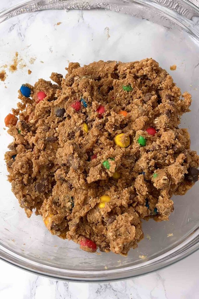 mixed dough in a large glass bowl