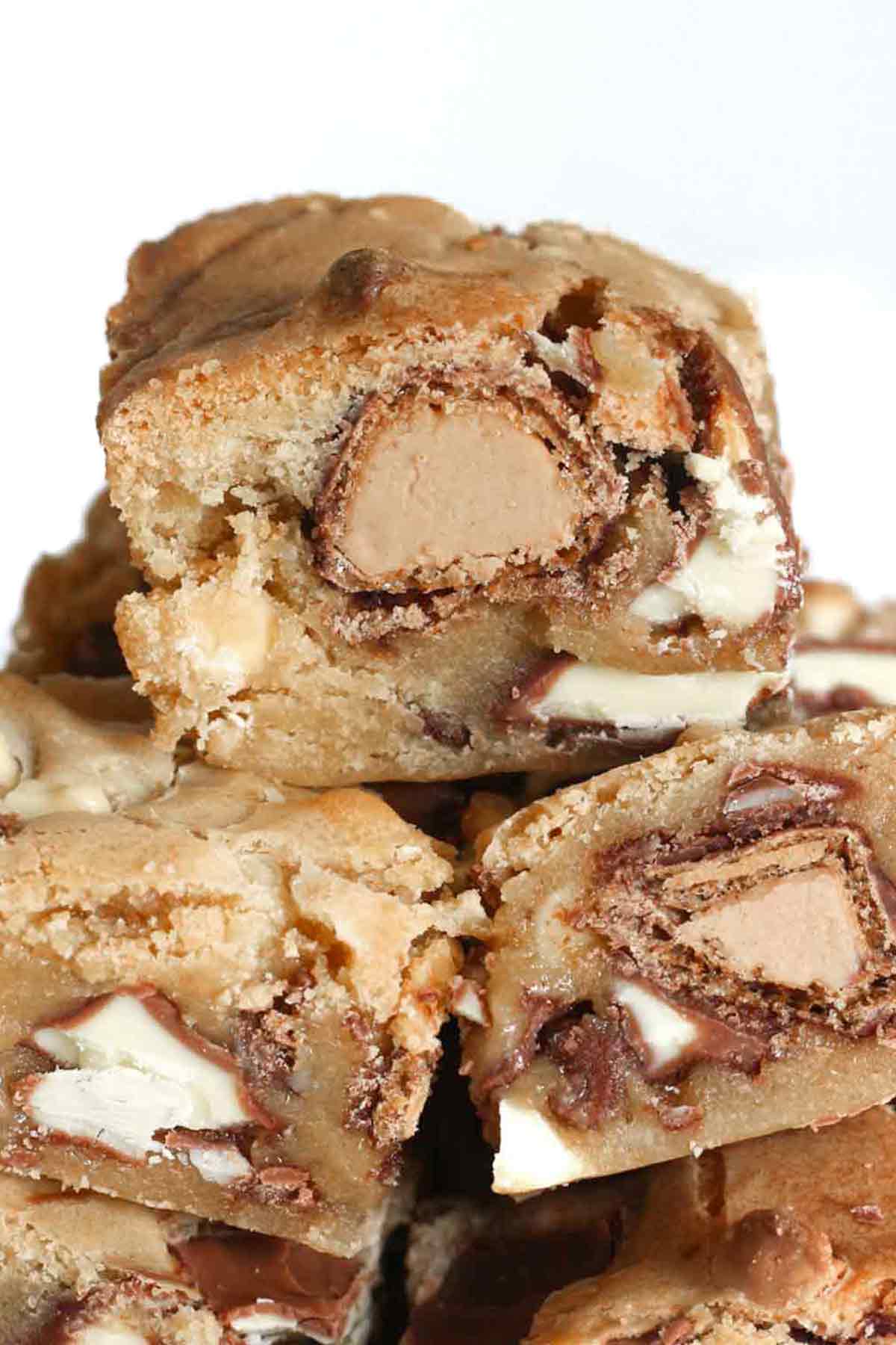 pile of kinder blondies with white background