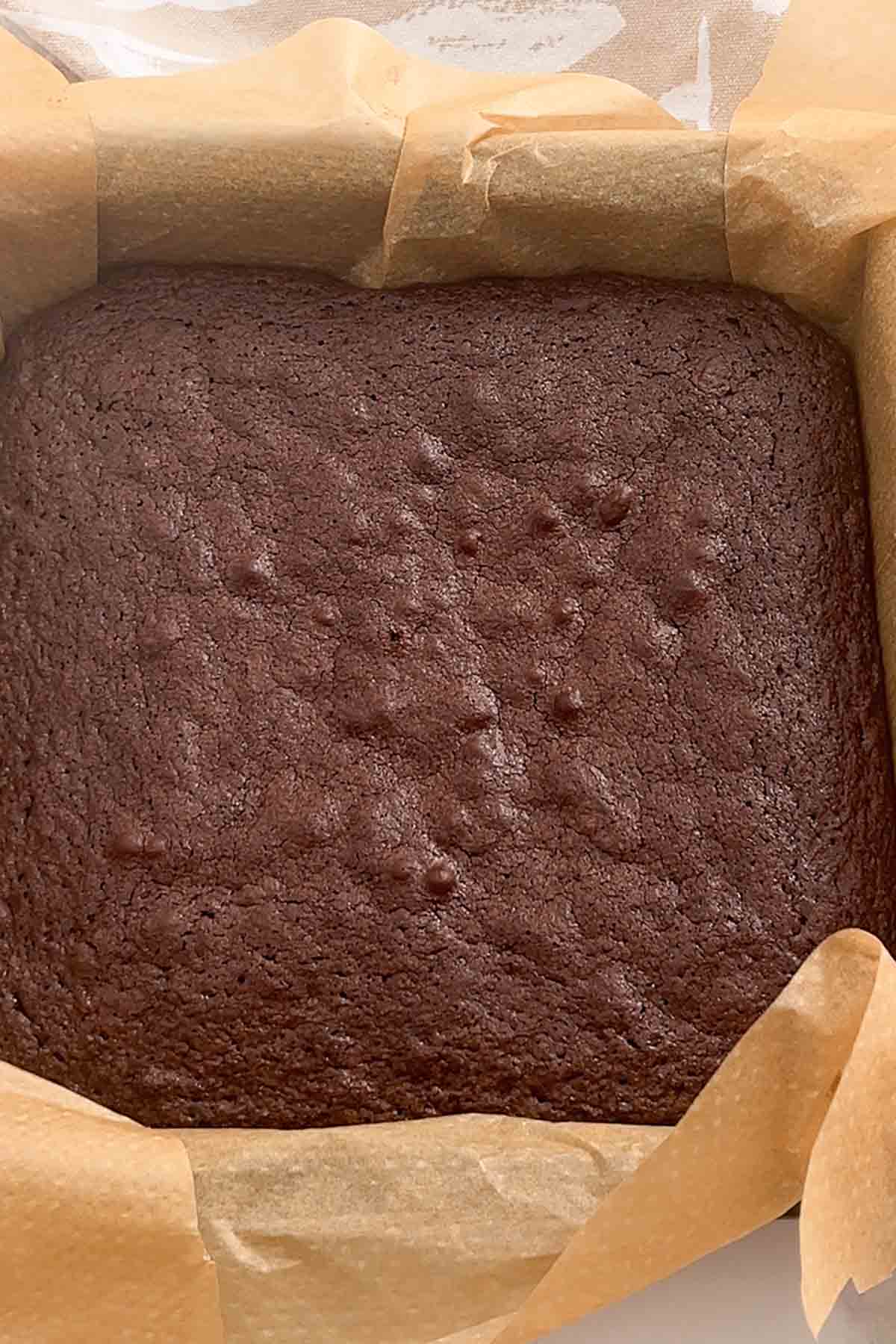baked brownies in lined tin