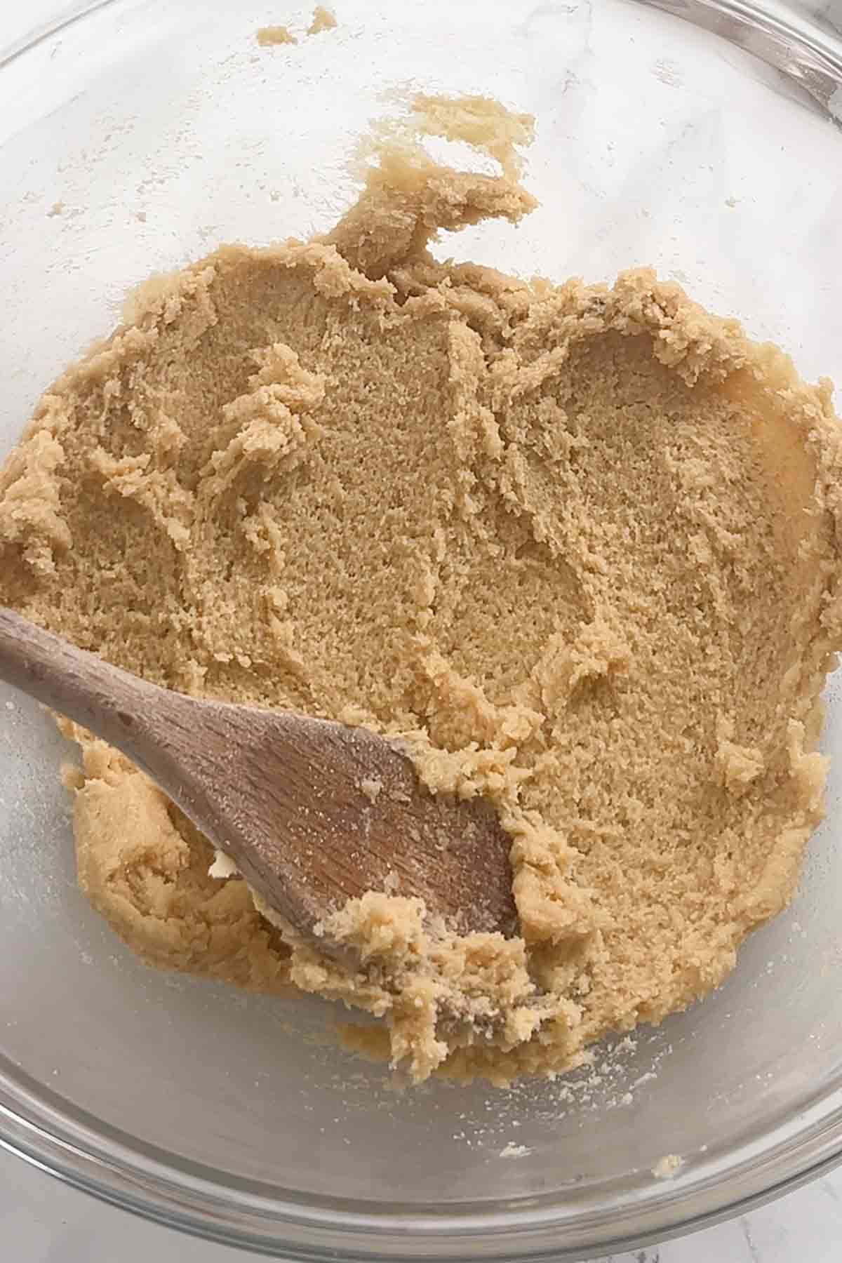 butter caster sugar and brown sugar creamed together in a bowl
