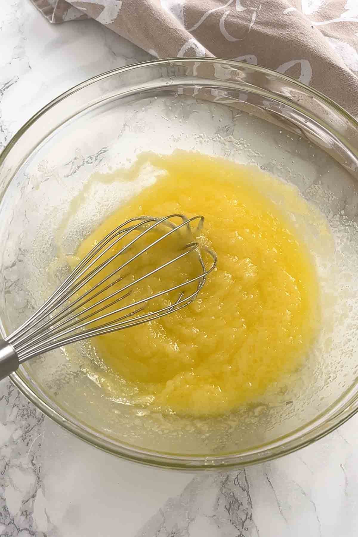 melted butter and sugar mixed together in a bowl