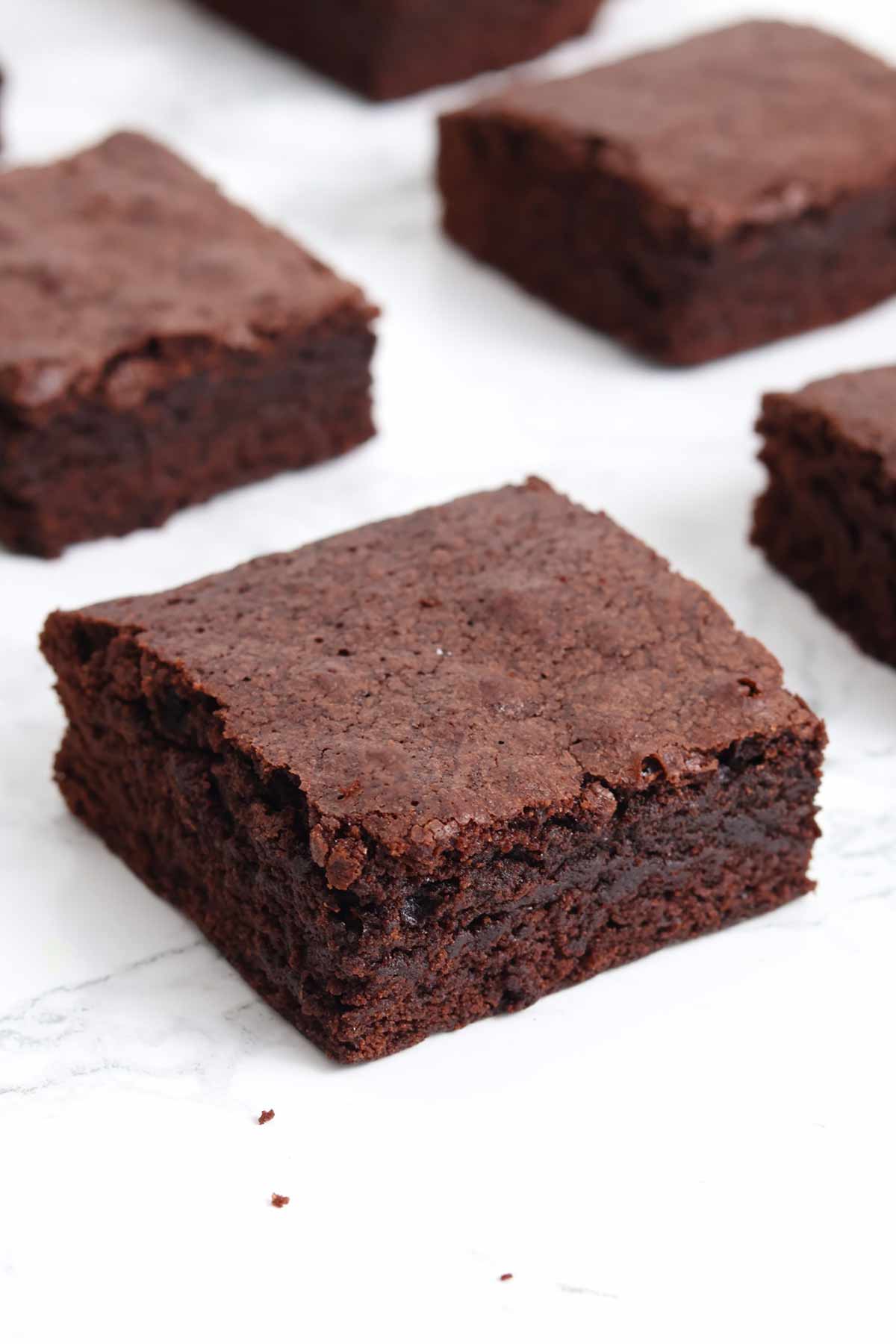 slices of cakey brownie on a white worktop