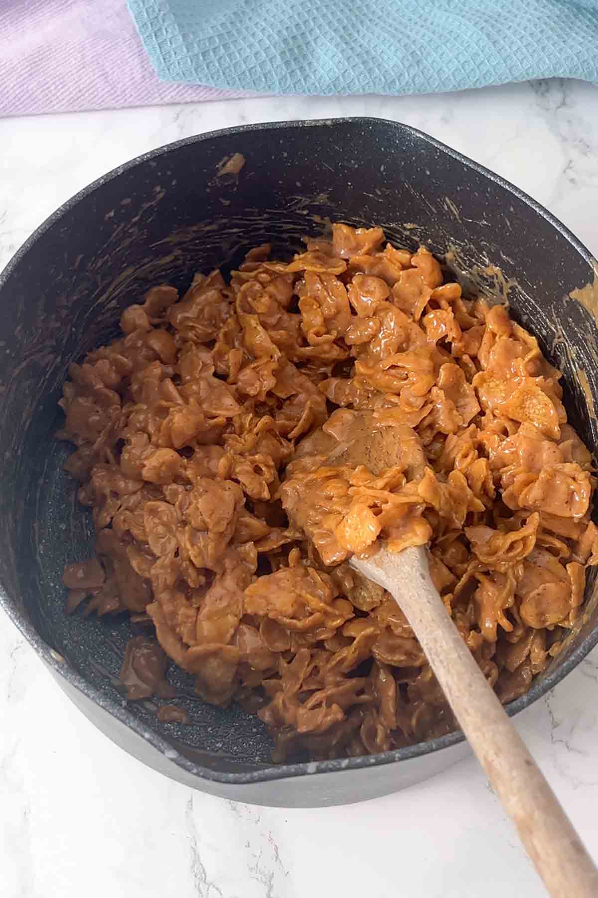 peanut butter cornflake mixture in a saucepan