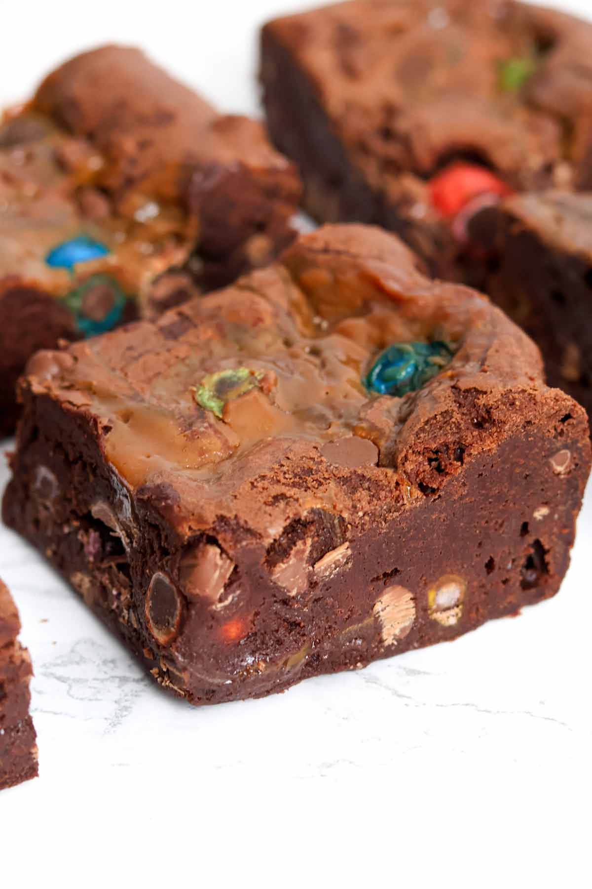 slices of caramel M&M brownies