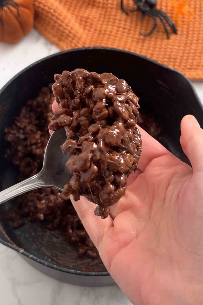 chocolate krispie mixture on a spoon