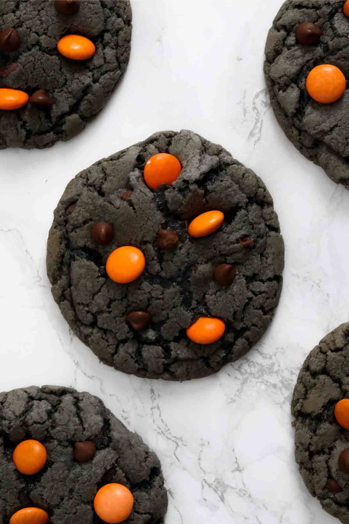 halloween chocolate chip cookies on a white surface