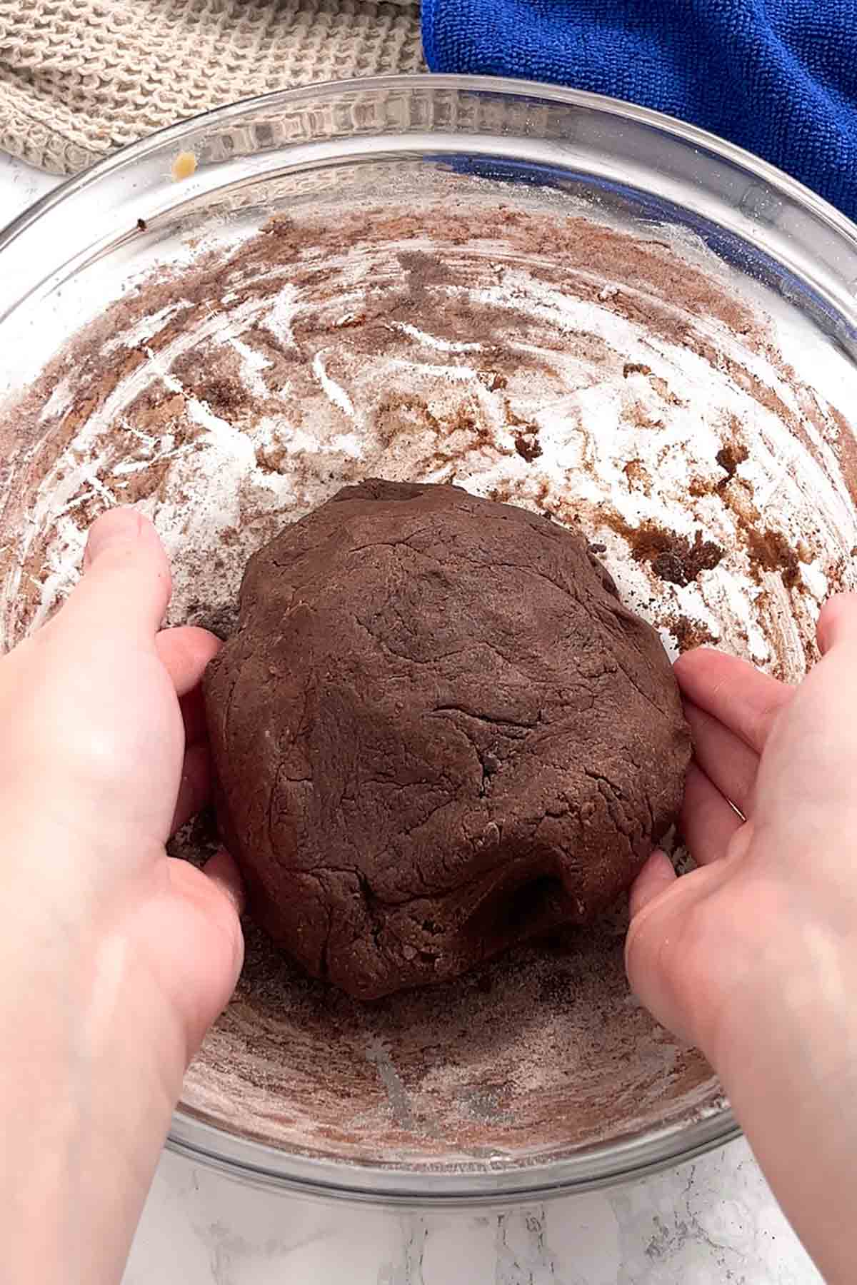 large ball of chocolate cookie dough in a bowl