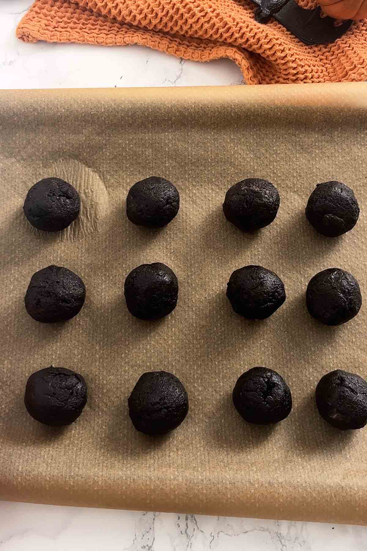 oreo balls on a lined baking tray