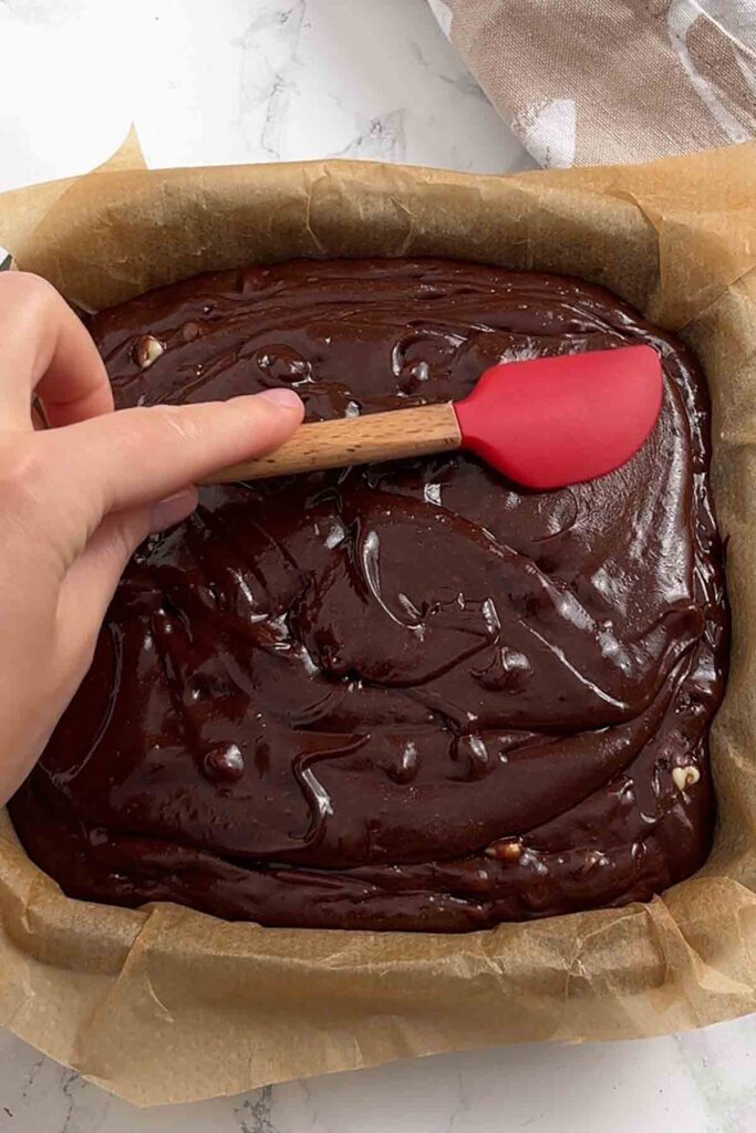 spreading batter into the tin