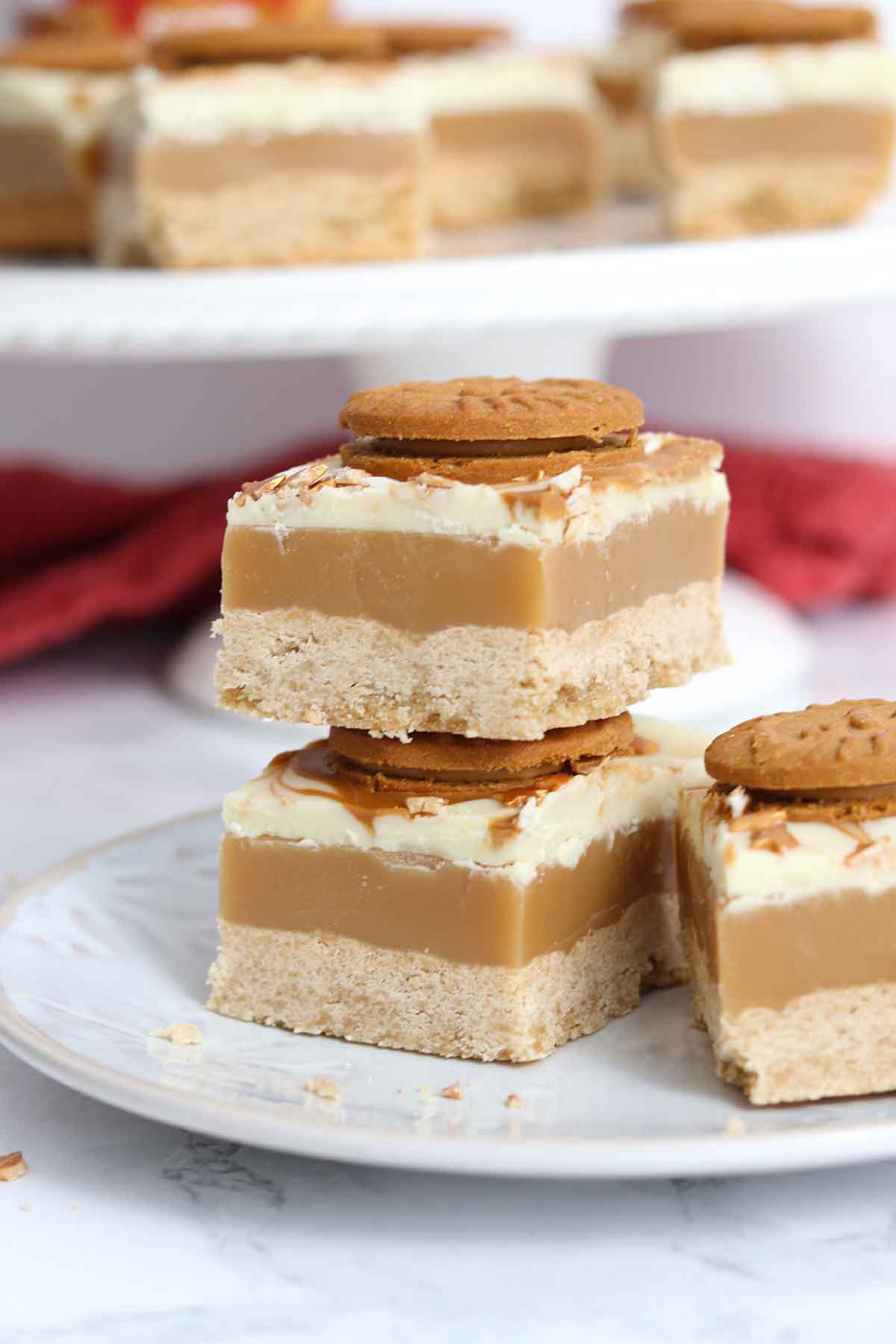 three pieces of biscoff millionaires shortbread on a plate
