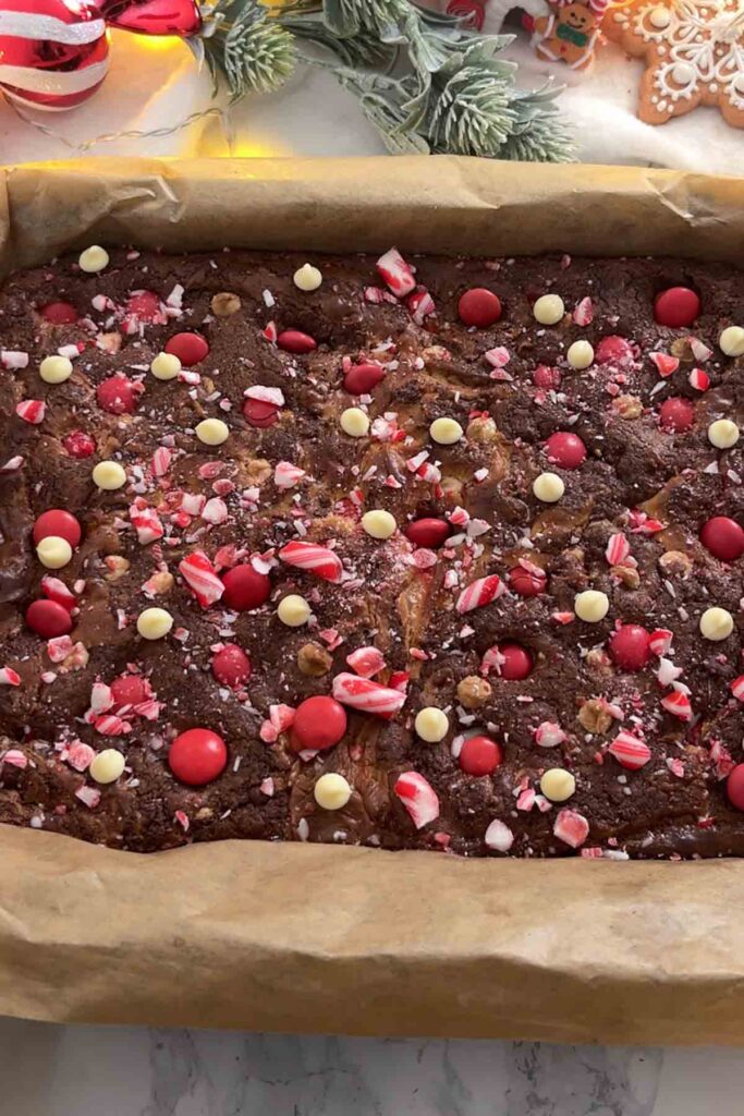 baked cookie in tin with candy canes on top