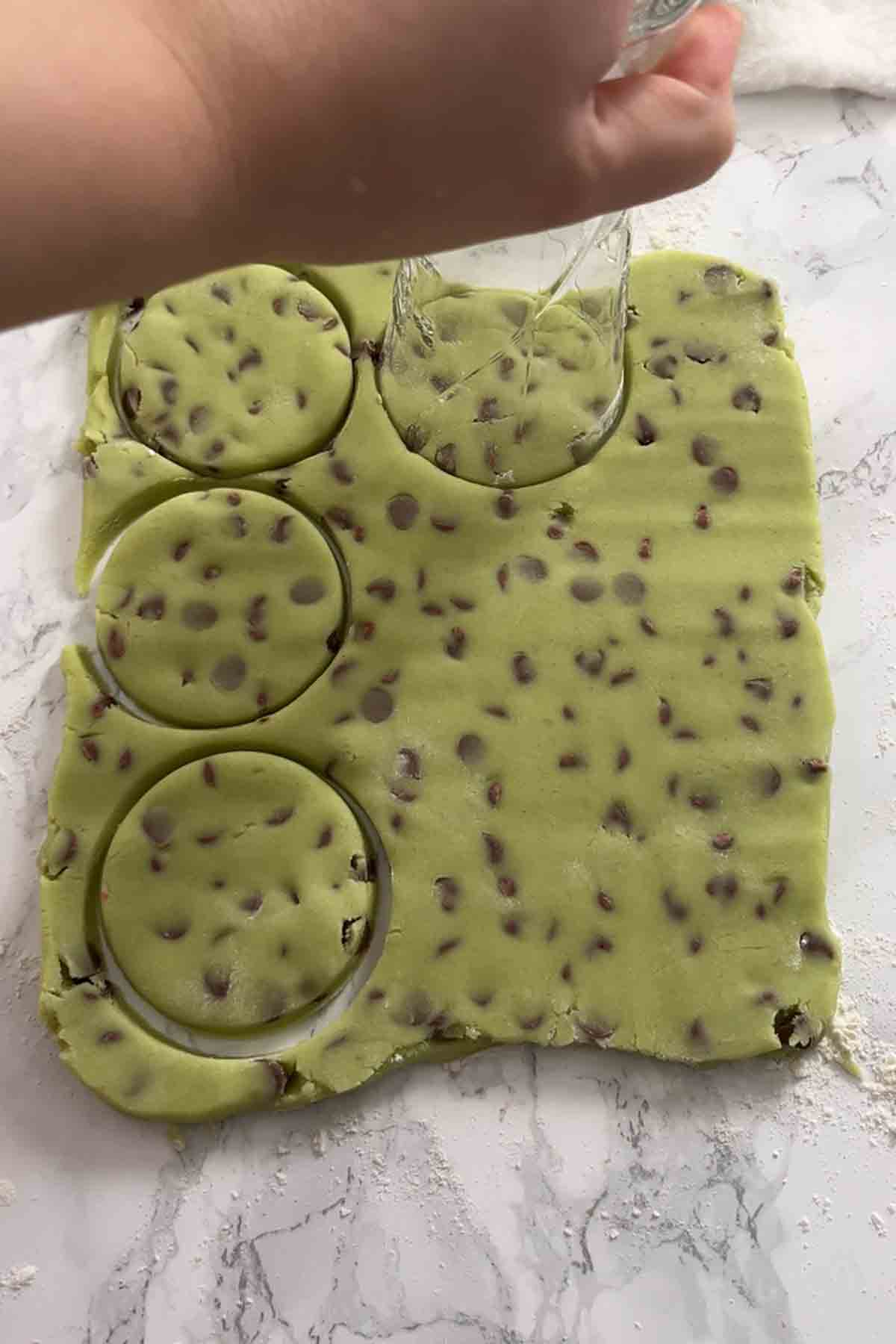 cutting circles out of the rolled dough