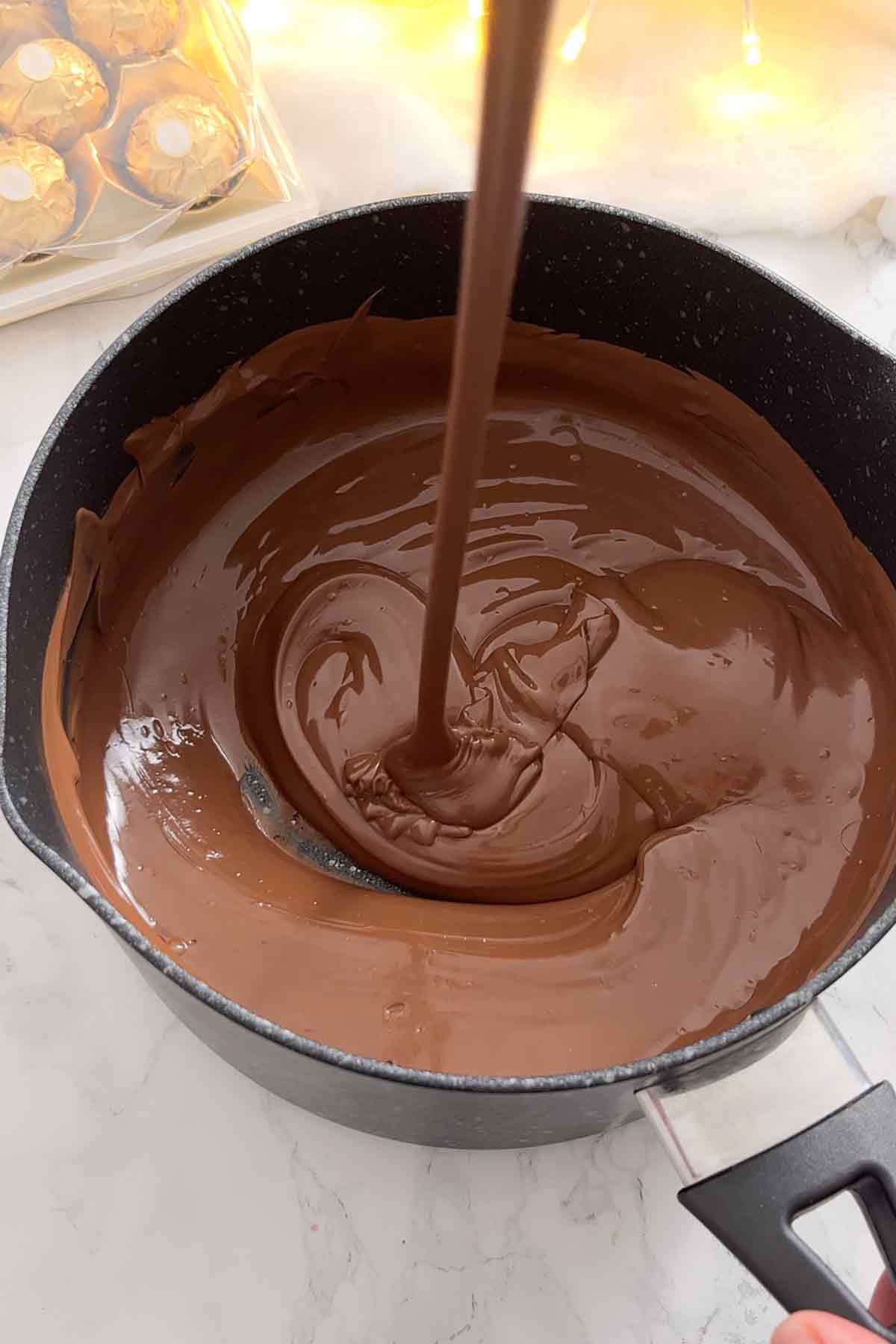 nutella and milk chocolate melted together in a saucepan