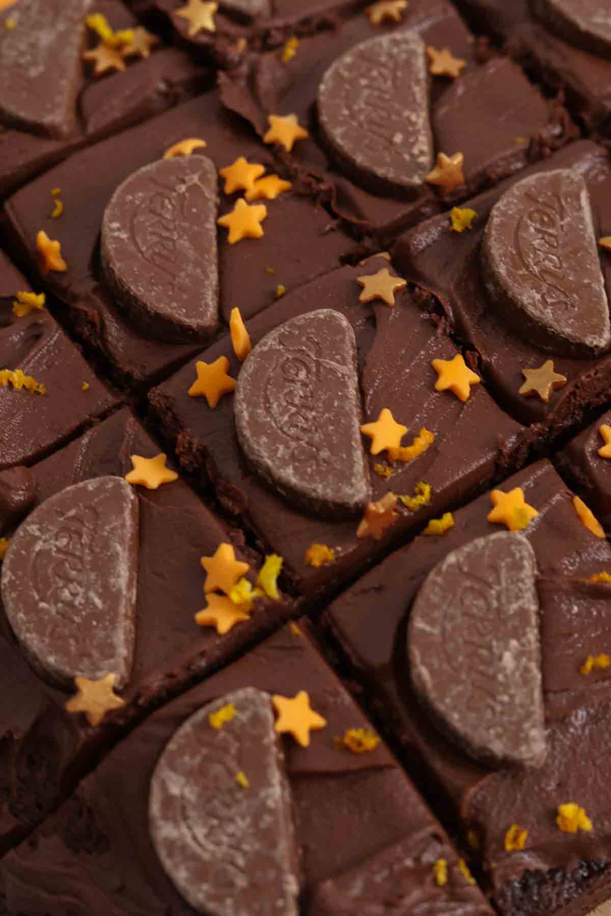 overhead image of terrys chocolate orange tray bake cake cut into slices