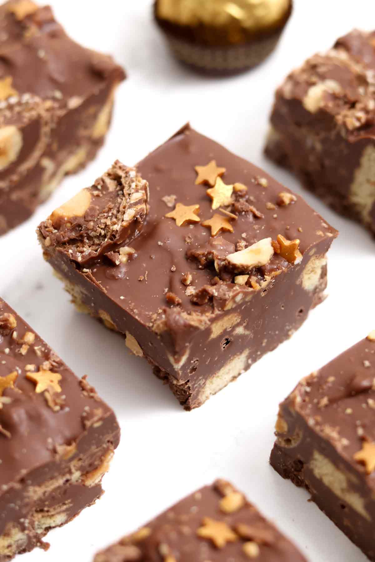 slices of ferrero rocher traybake on a white worktop
